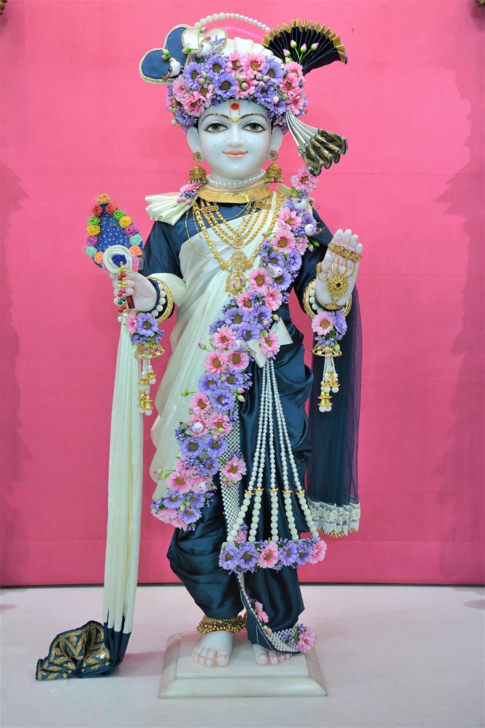Swaminarayan adorned with floral garland