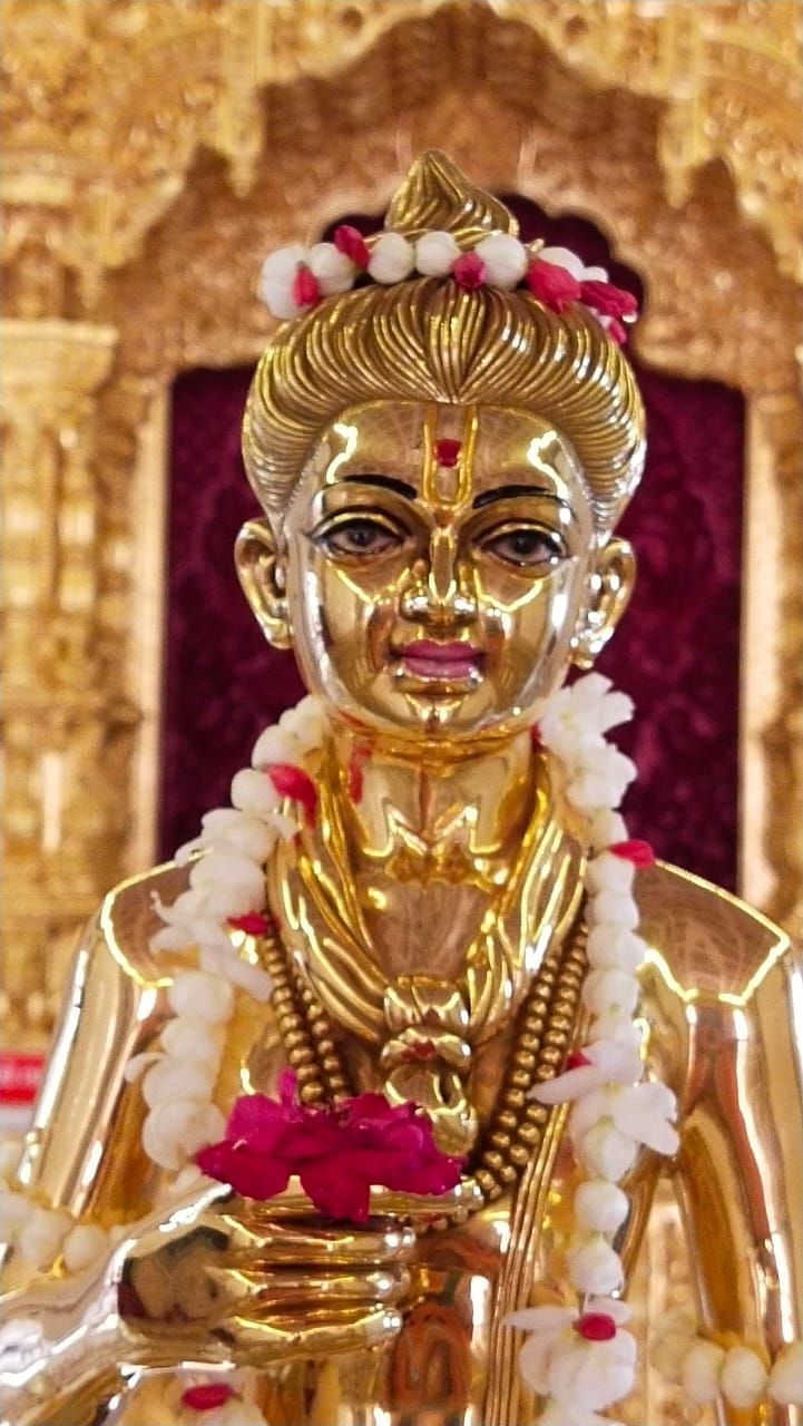 Golden statue of Swaminarayan Bhagwan.