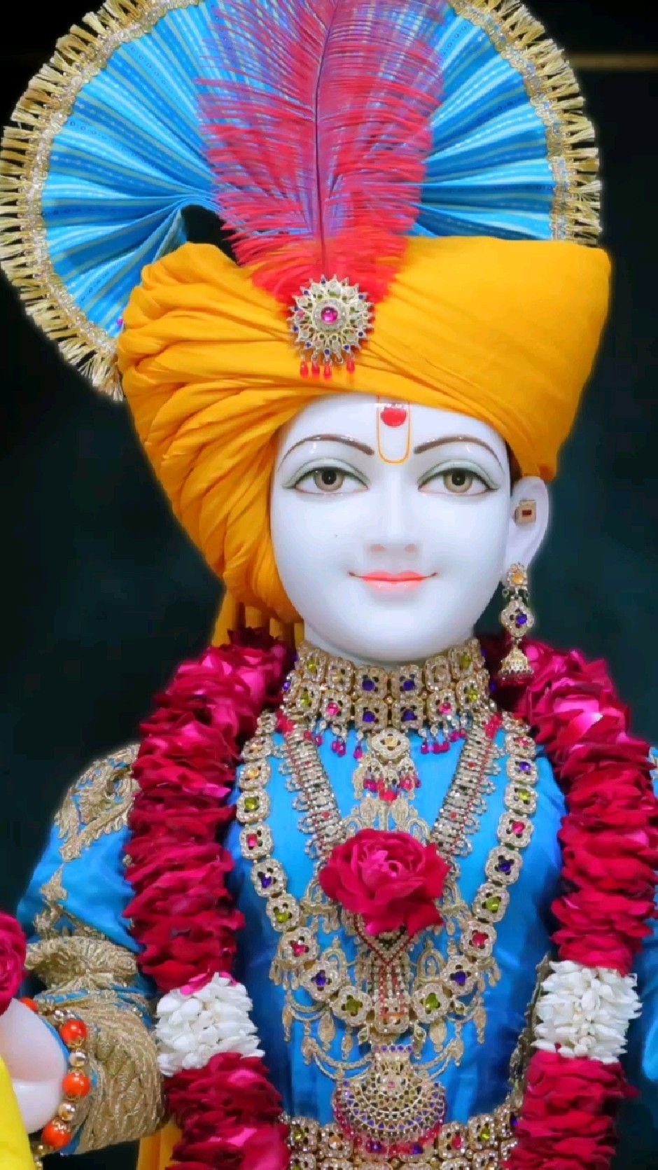 Swaminarayan Bhagwan in golden attire.