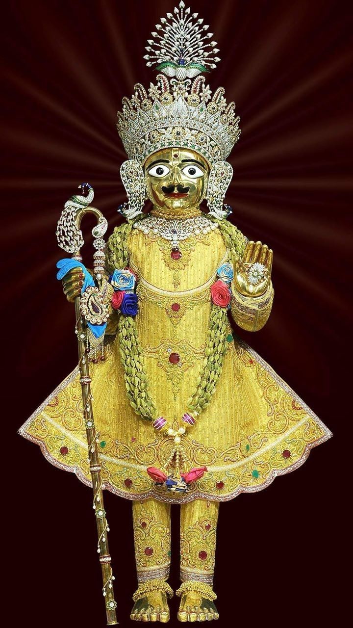 Swaminarayan adorned in golden splendor