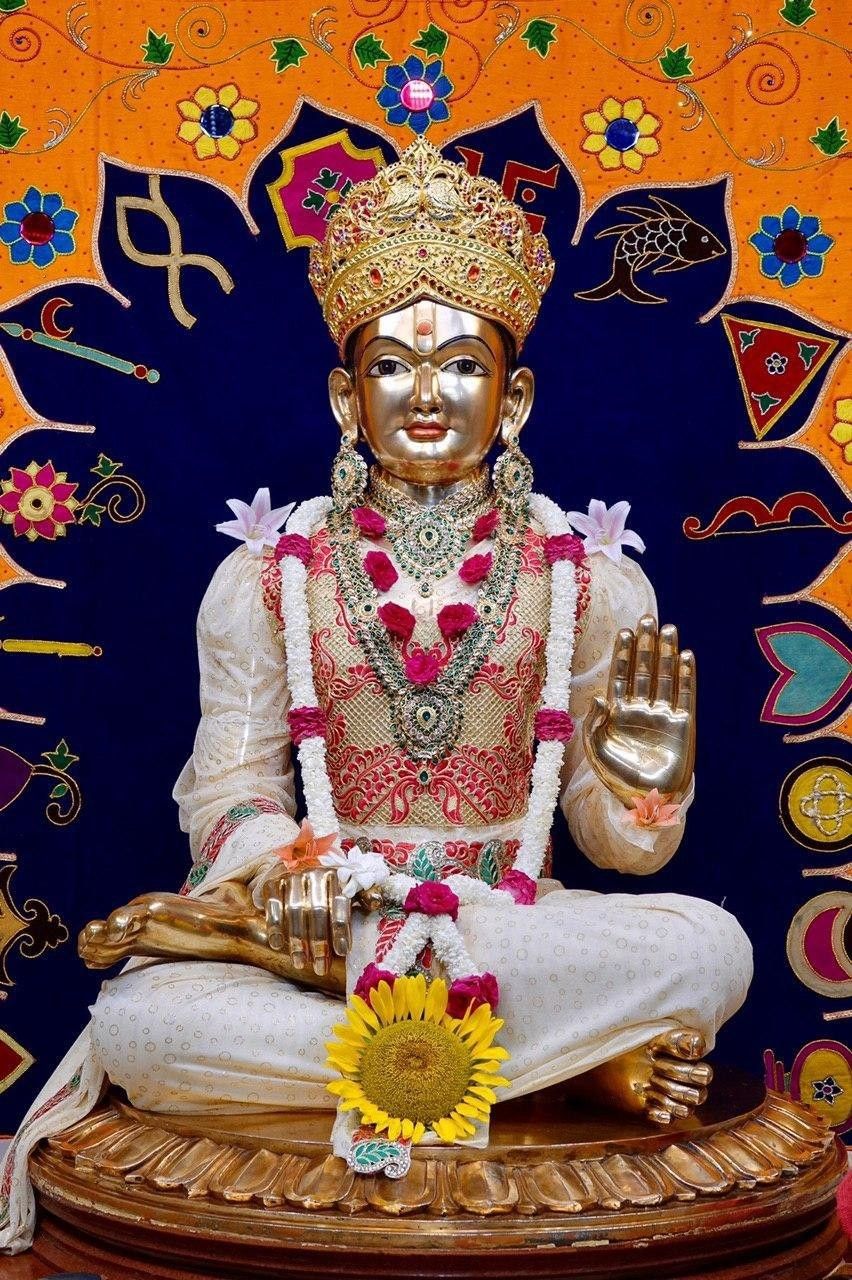 Swaminarayan deity in golden attire.