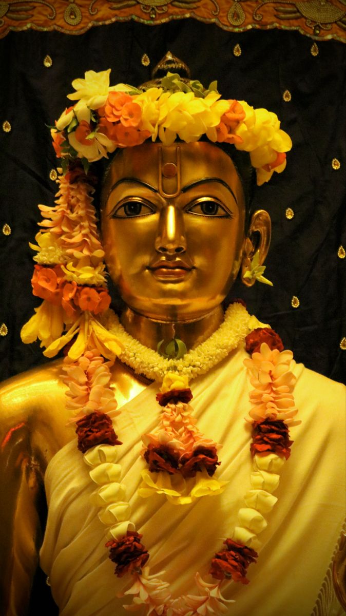 Golden Swaminarayan with floral garland
