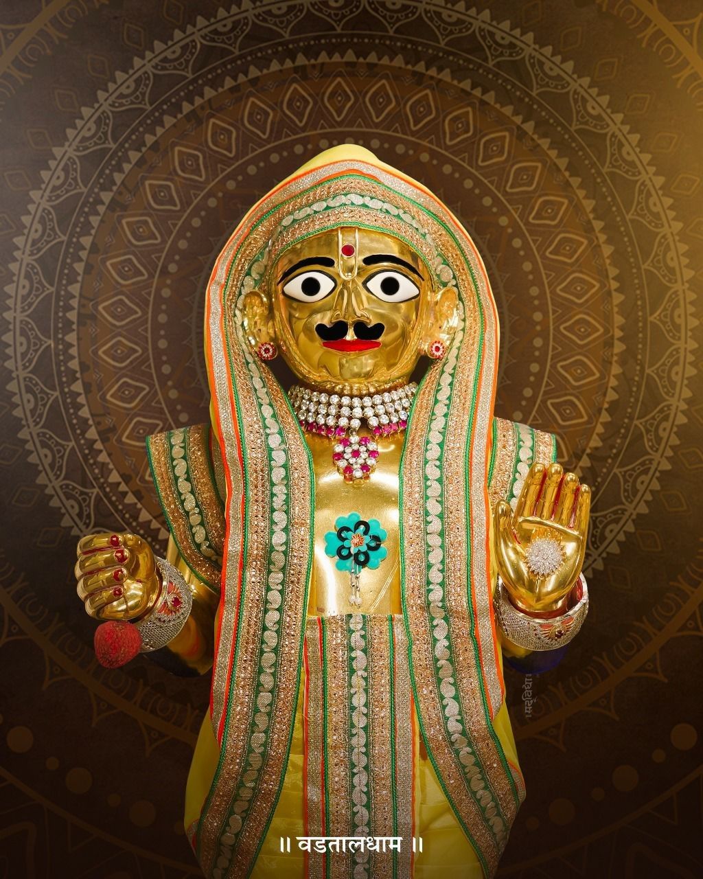 Swaminarayan deity in golden attire
