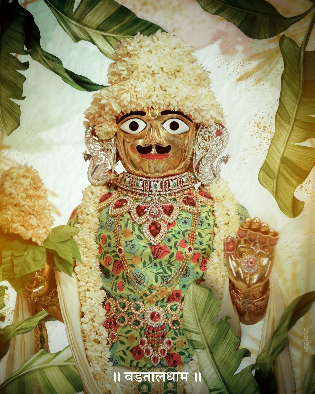 Swaminarayan adorned with floral garland