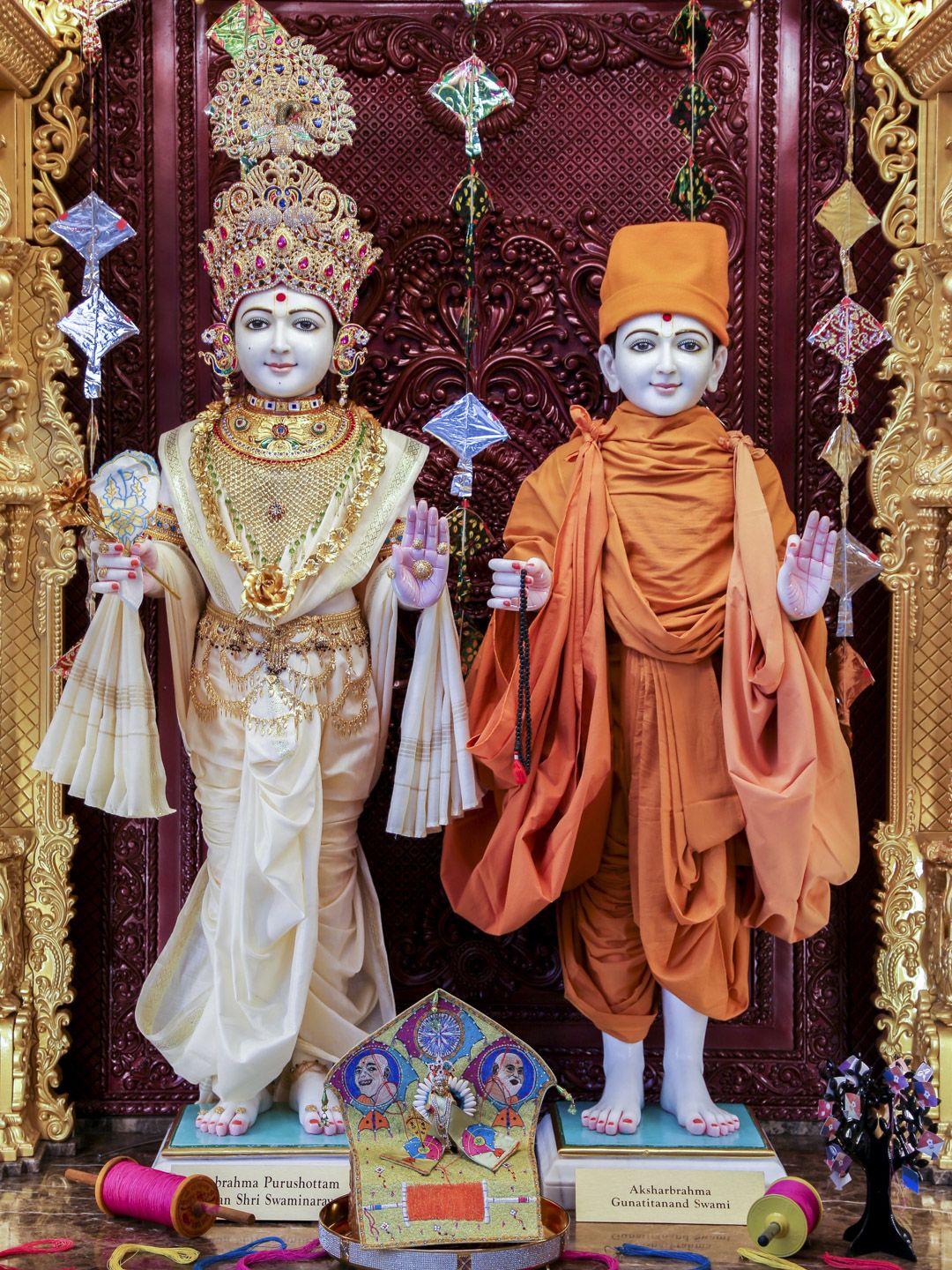 Swaminarayan figures in golden attire