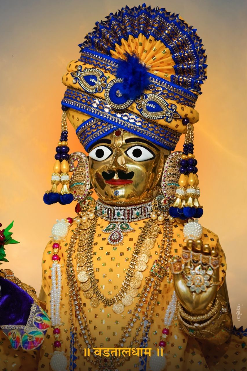 Golden Swaminarayan portrait radiating divine light