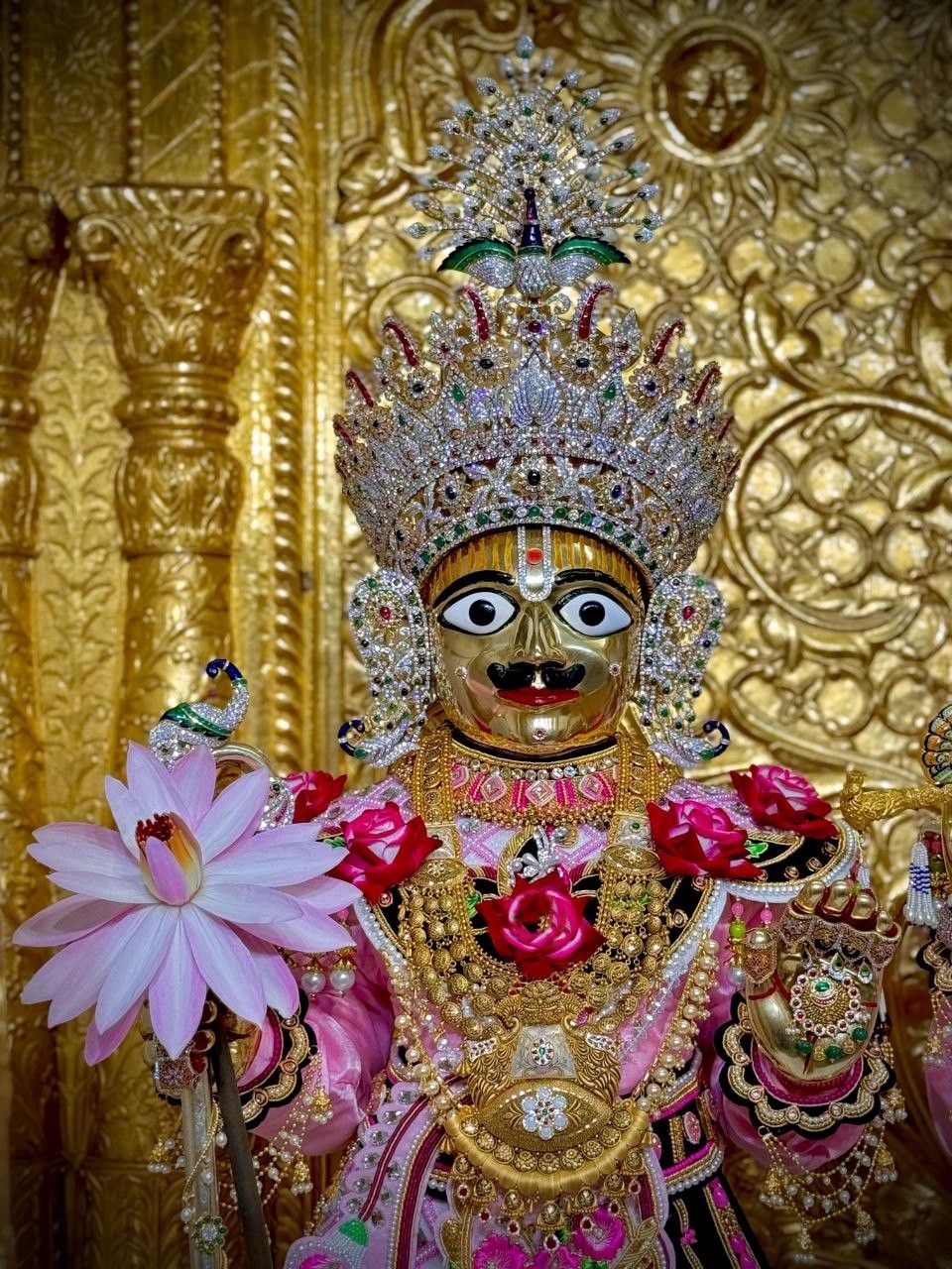 Swaminarayan with lotus flower, golden crown