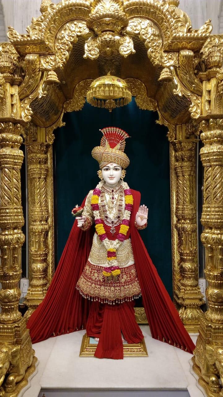 Swaminarayan Maharaj in ornate temple setting