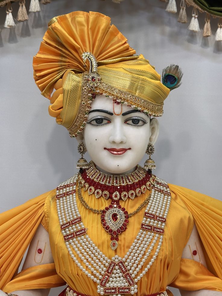 Swaminarayan adorned in golden jewels