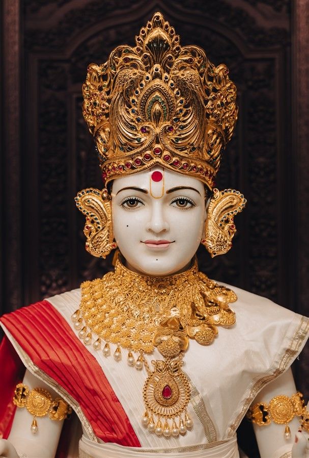 Swaminarayan with golden crown and jewels
