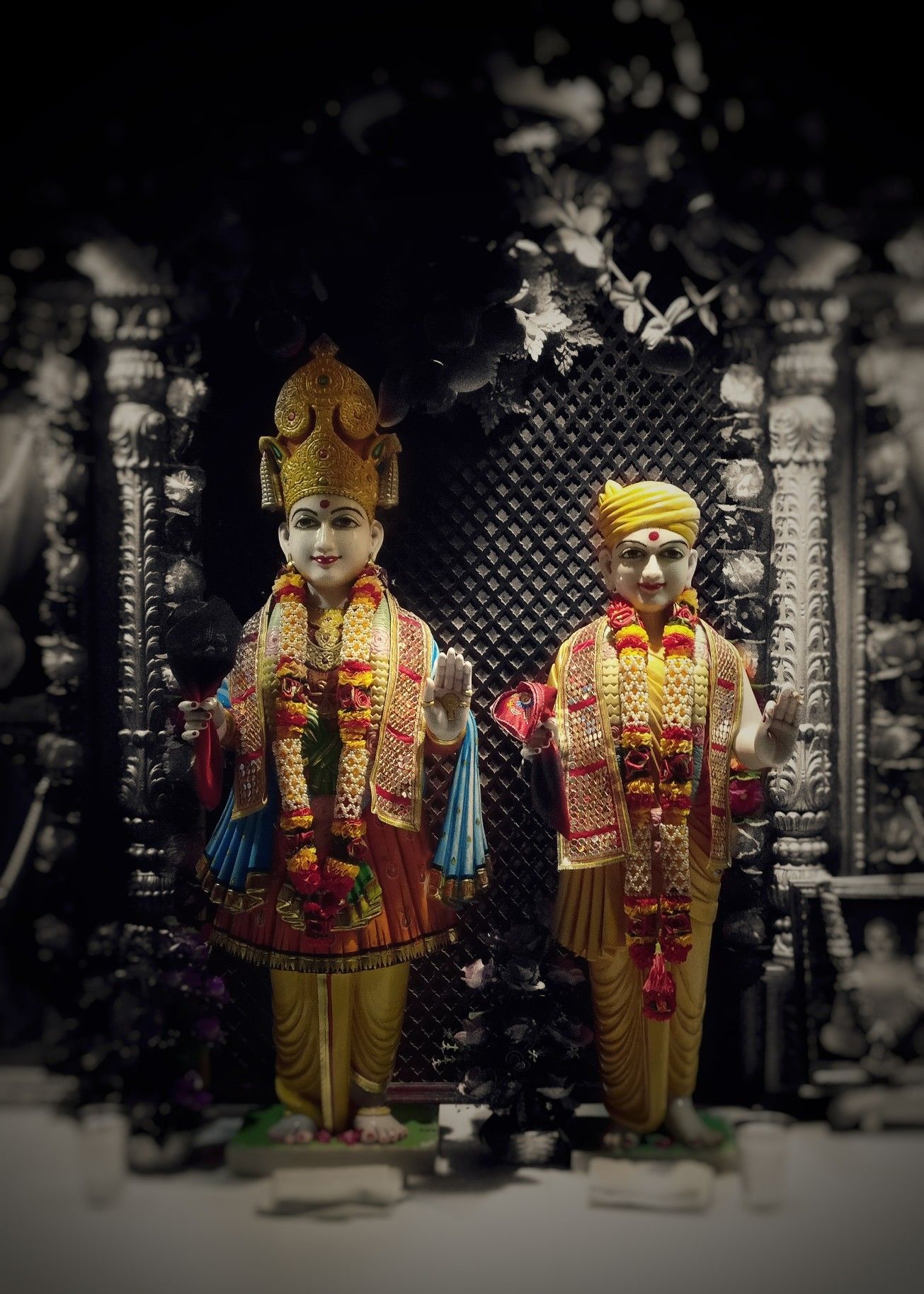 Swaminarayan murtis in a temple setting