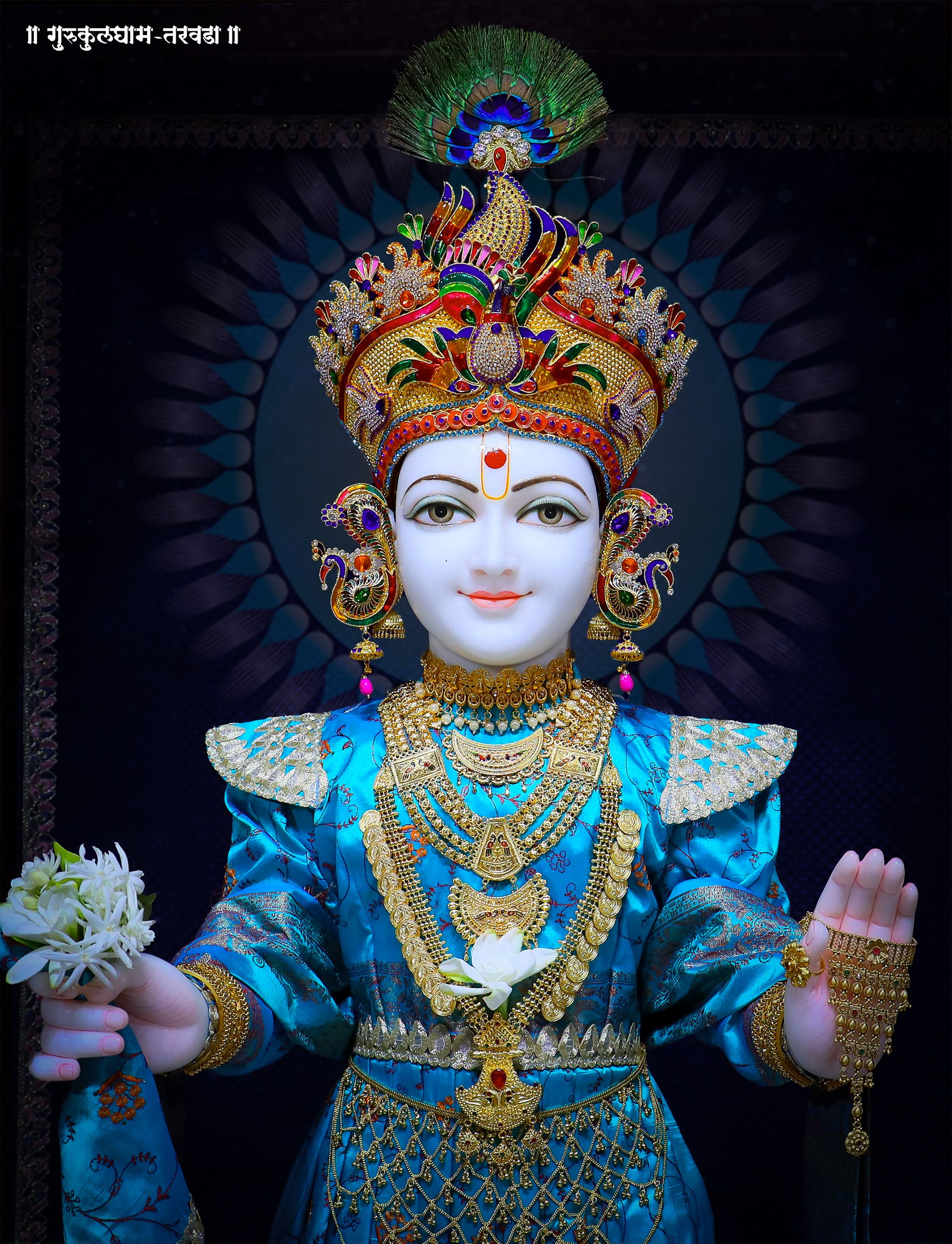 Swaminarayan with peacock feather crown