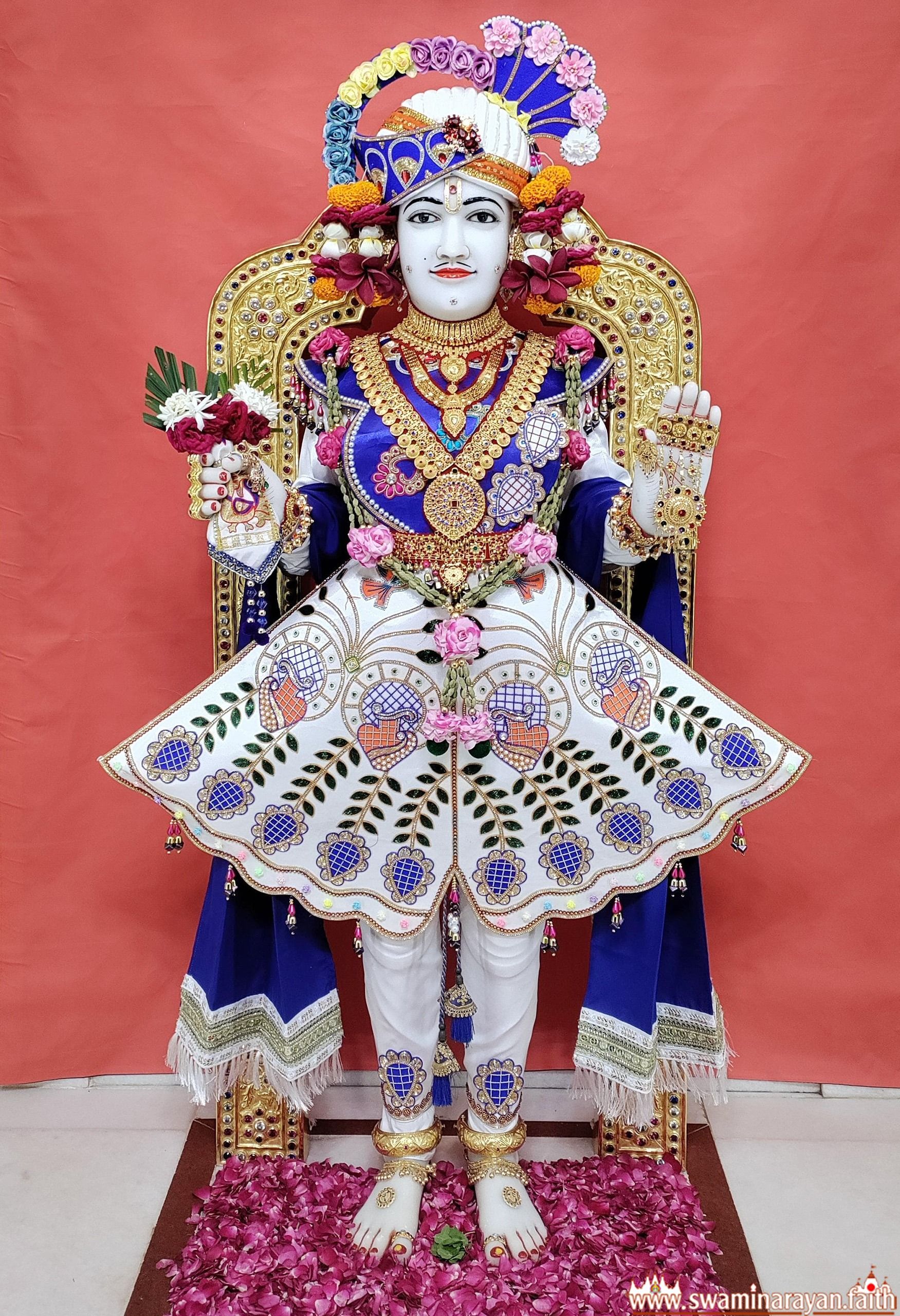 Swaminarayan seated on ornate throne