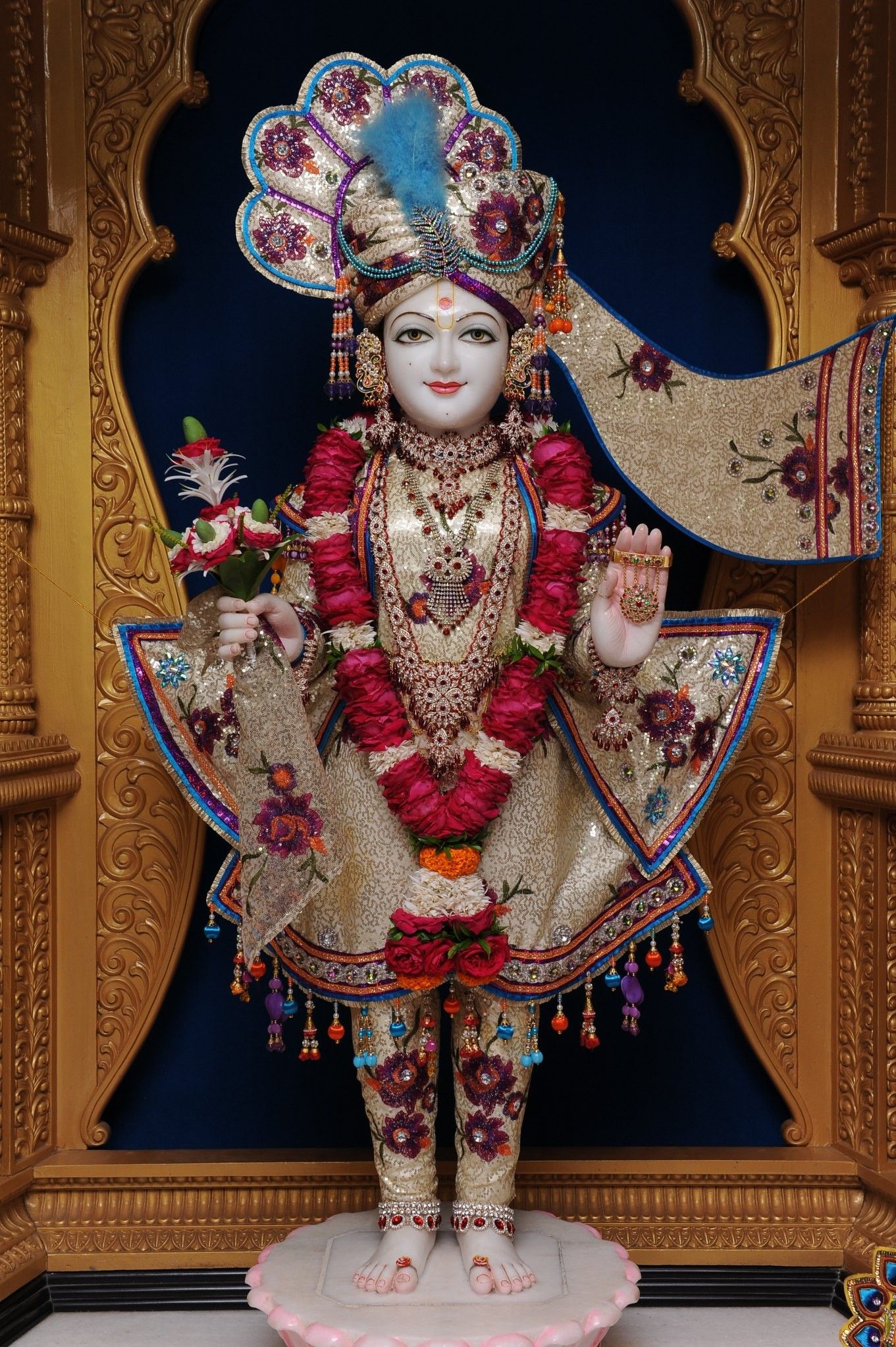 Swaminarayan murti adorned with flowers