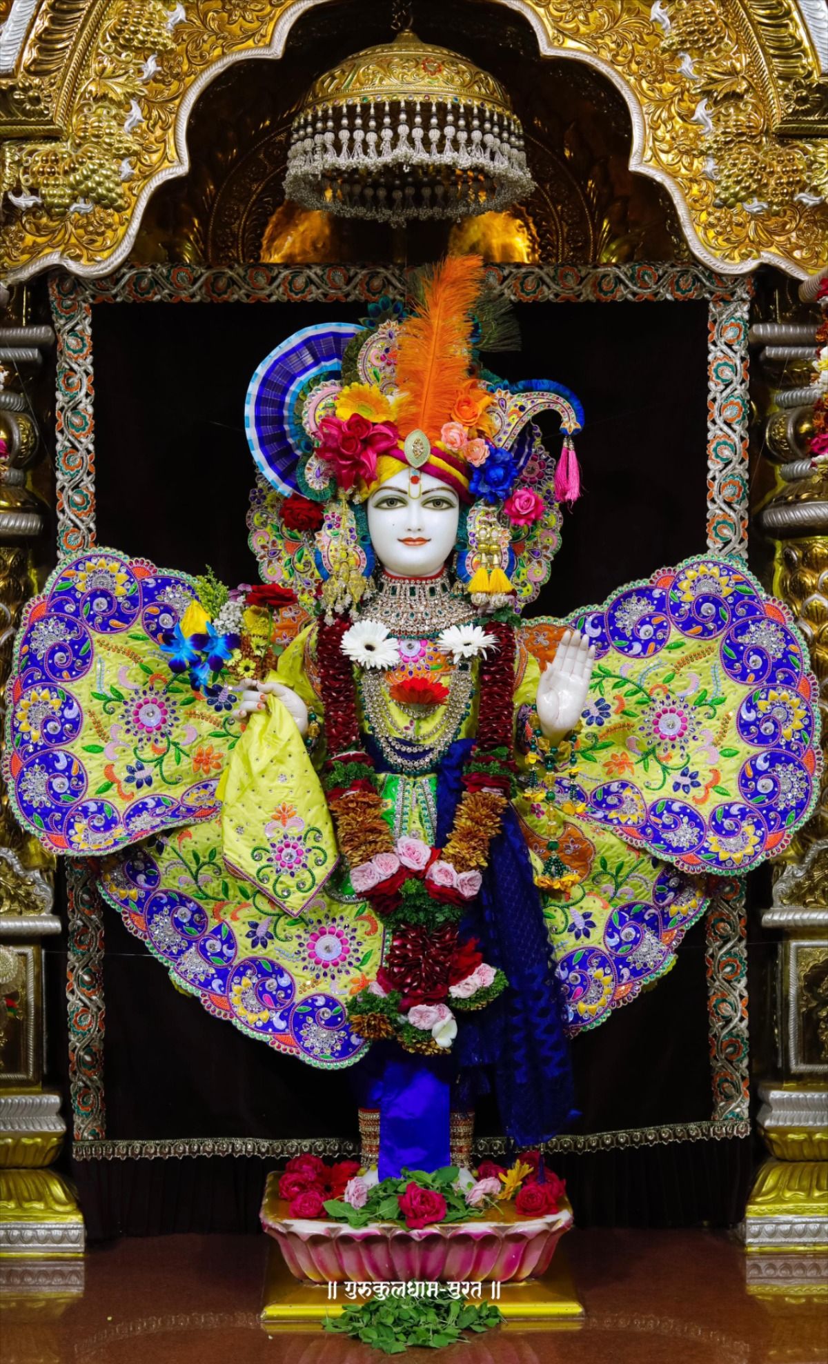 Swaminarayan deity adorned in vibrant attire