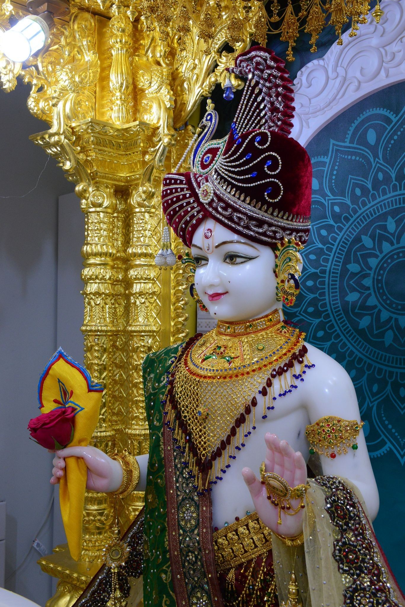 Swaminarayan statue with ornate crown