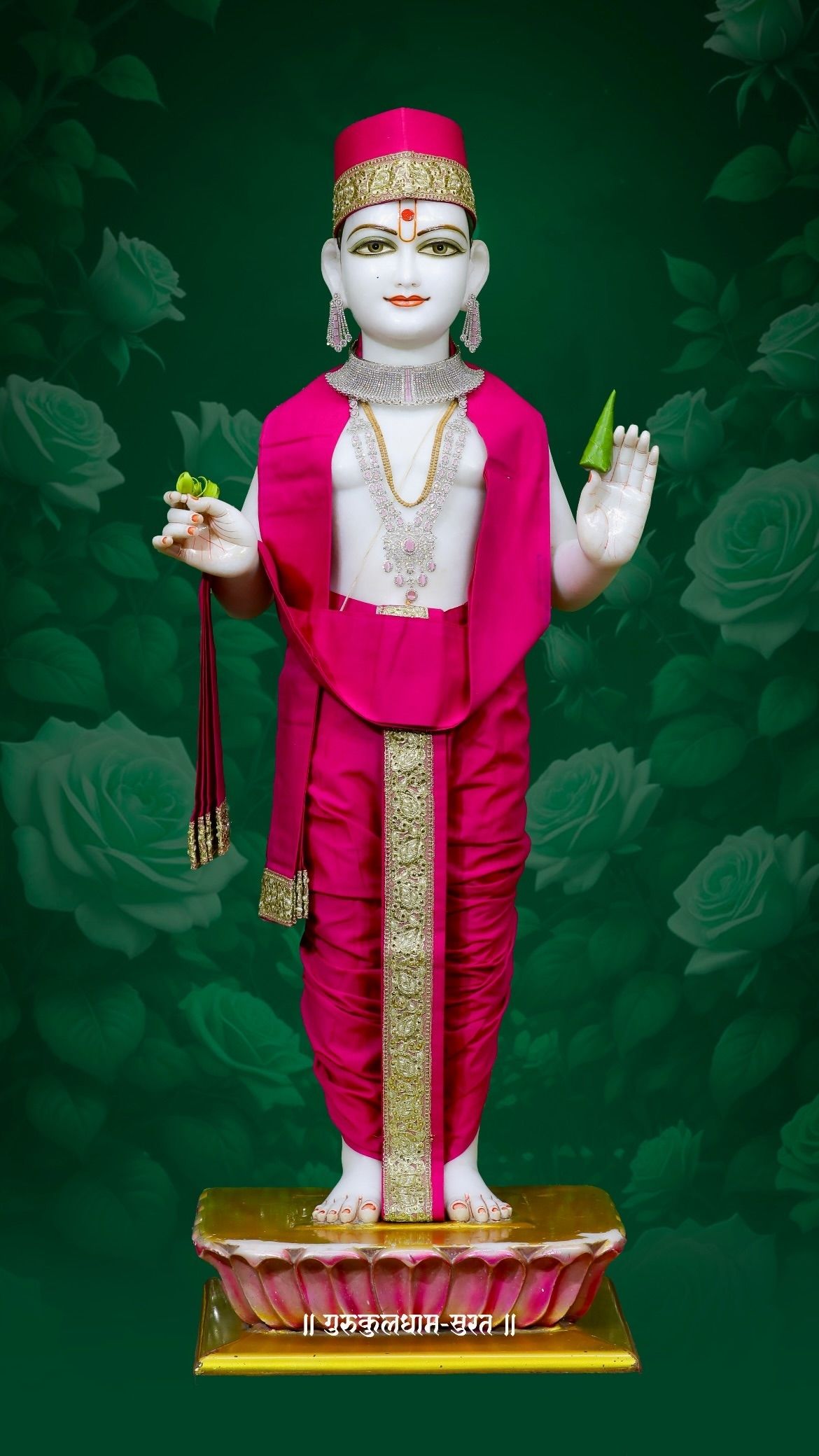 Swaminarayan idol with roses and jewels