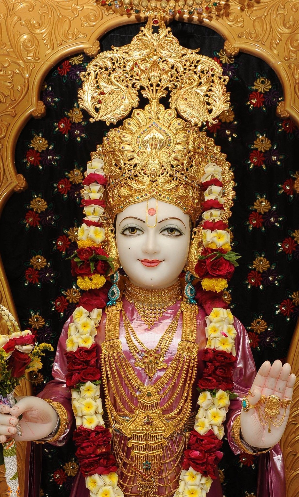 Swaminarayan idol with golden crown