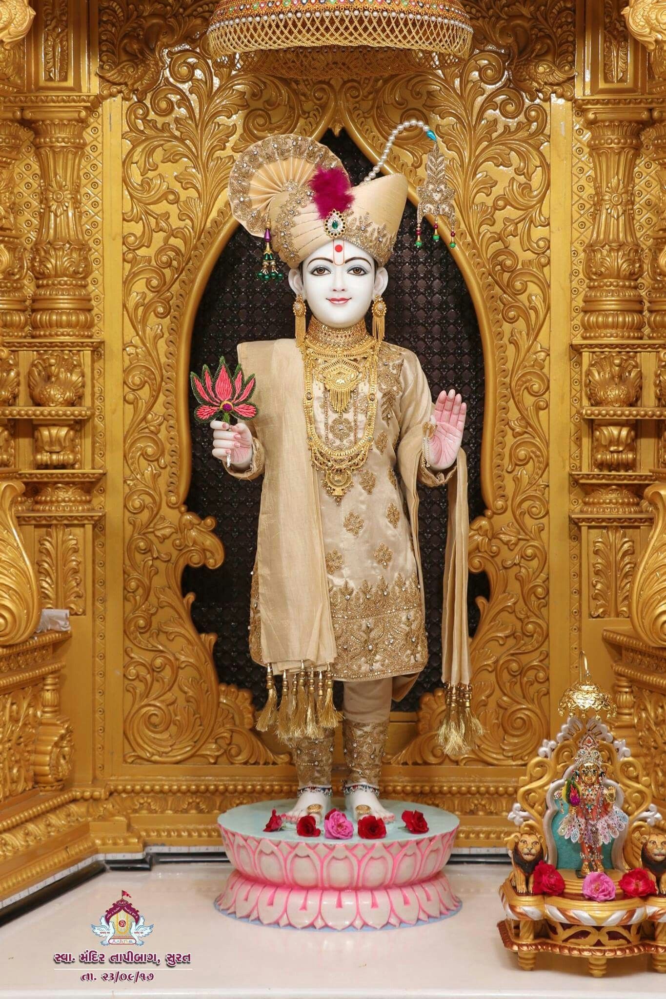 Swaminarayan statue in ornate temple setting