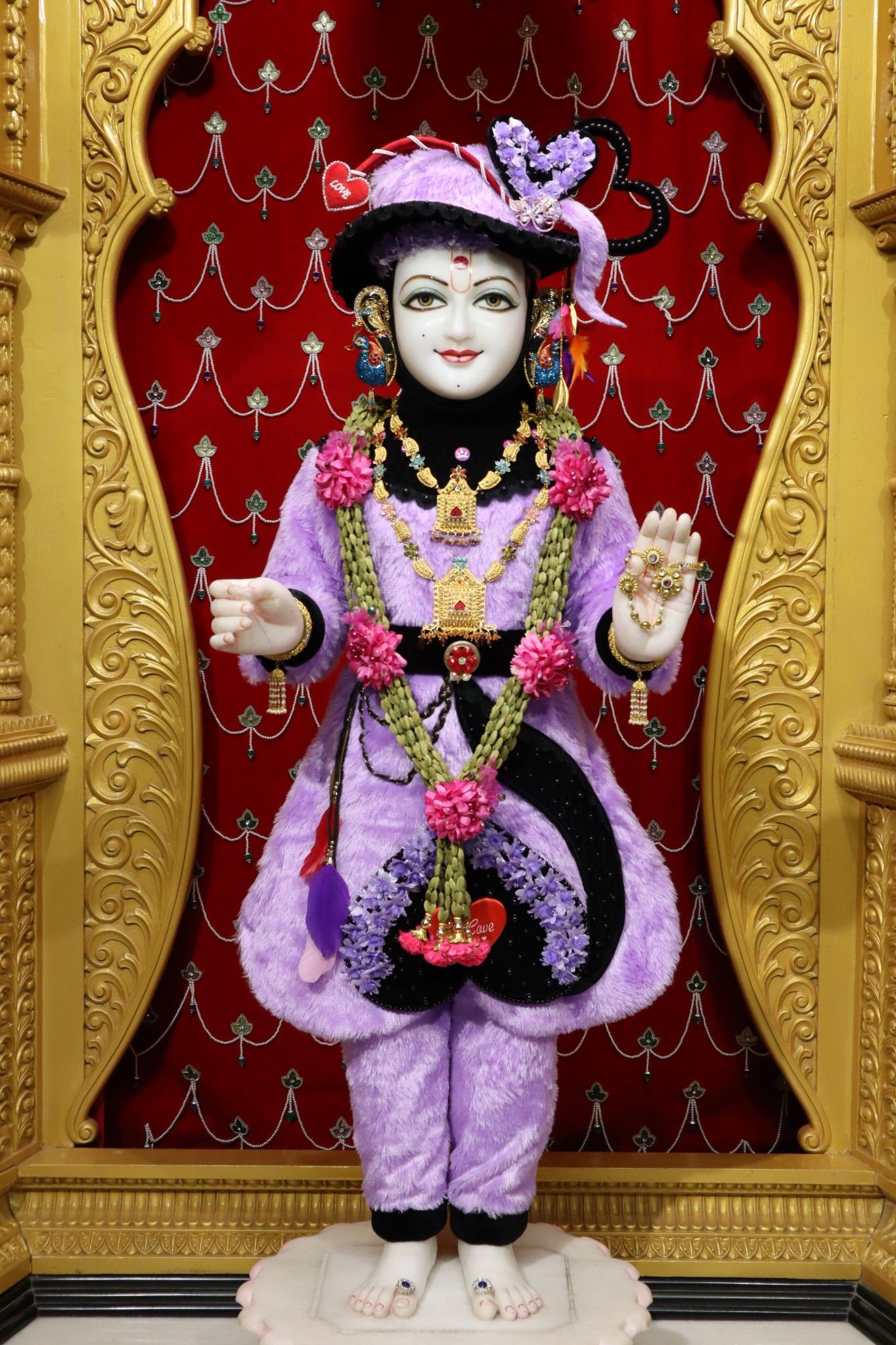 Swaminarayan murti in purple attire
