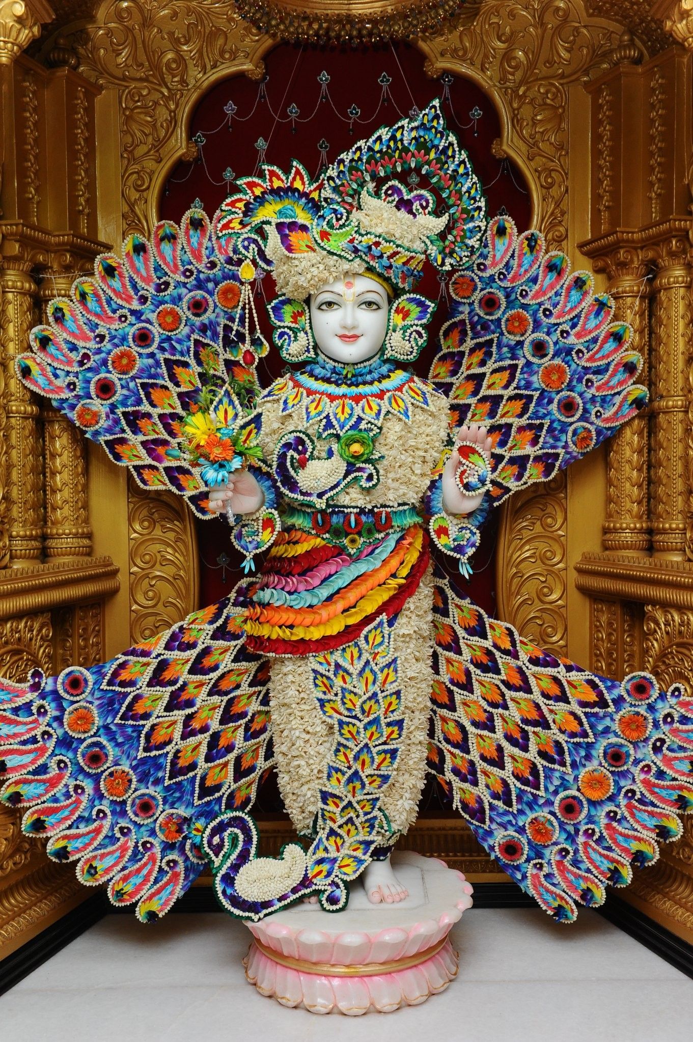 Swaminarayan with peacock feather adornments