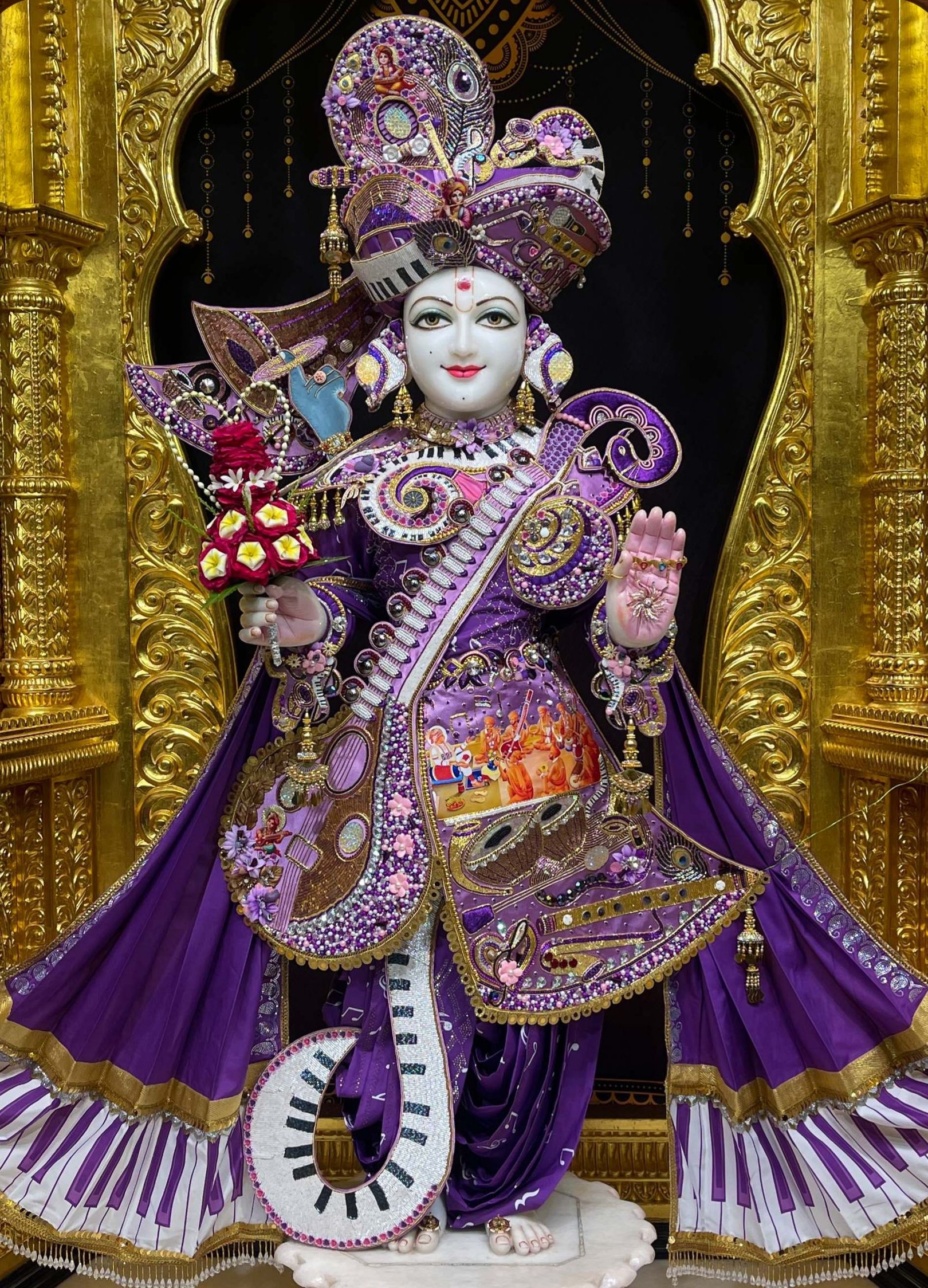Swaminarayan Bhagwan adorned in purple robes
