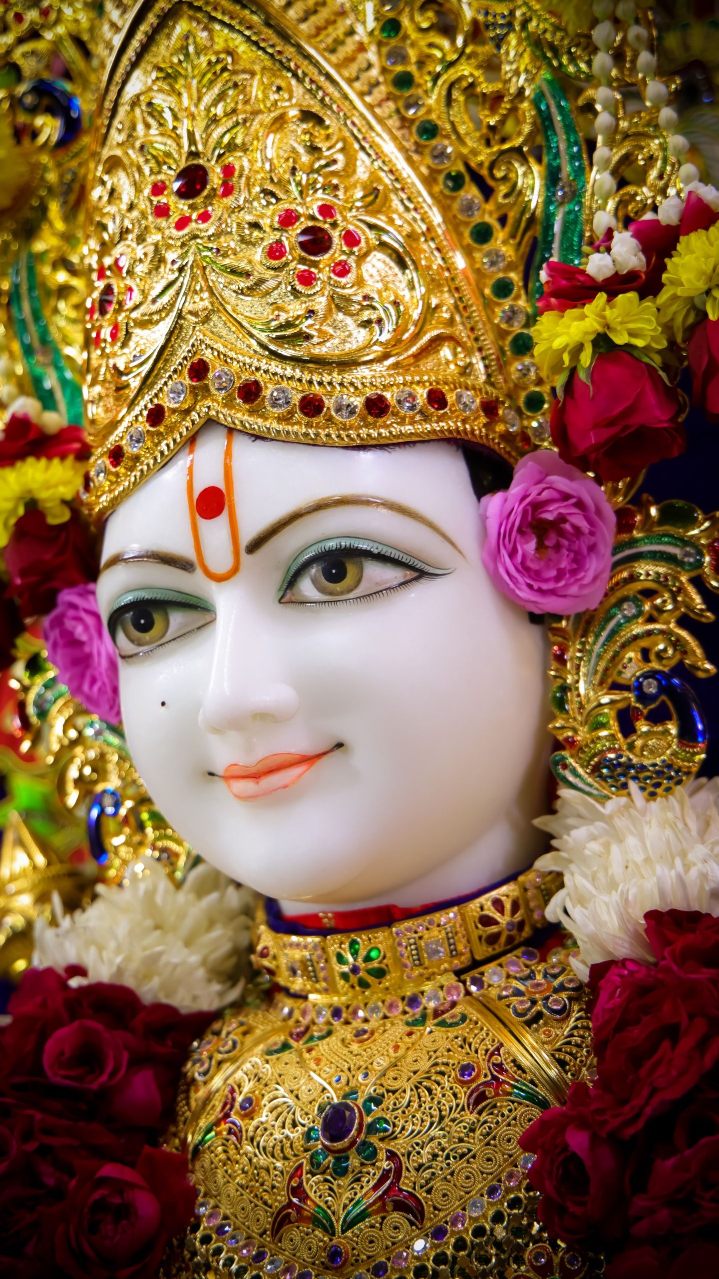 Close-up of Swaminarayan\'s serene face.