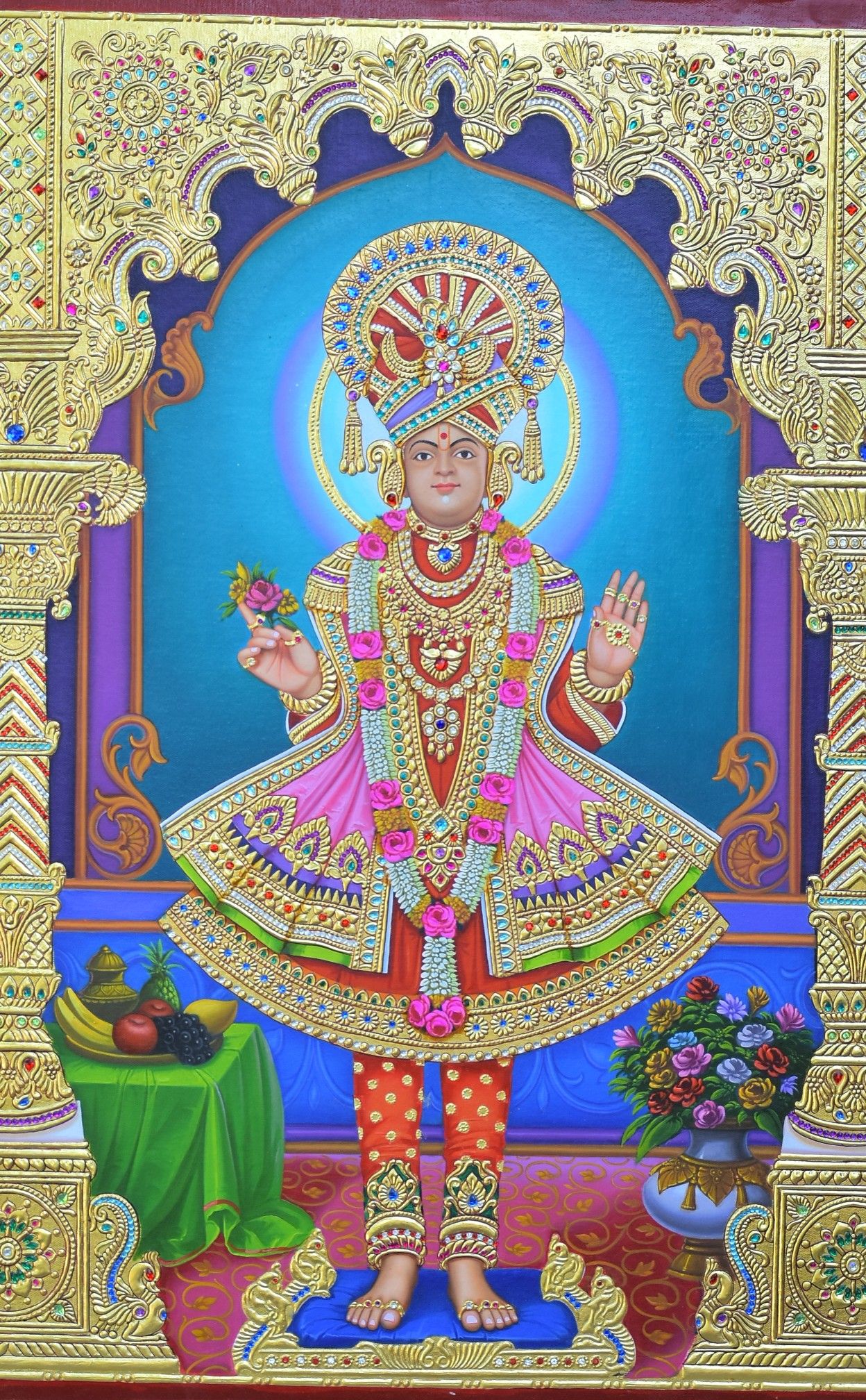 Swaminarayan in ornate golden attire