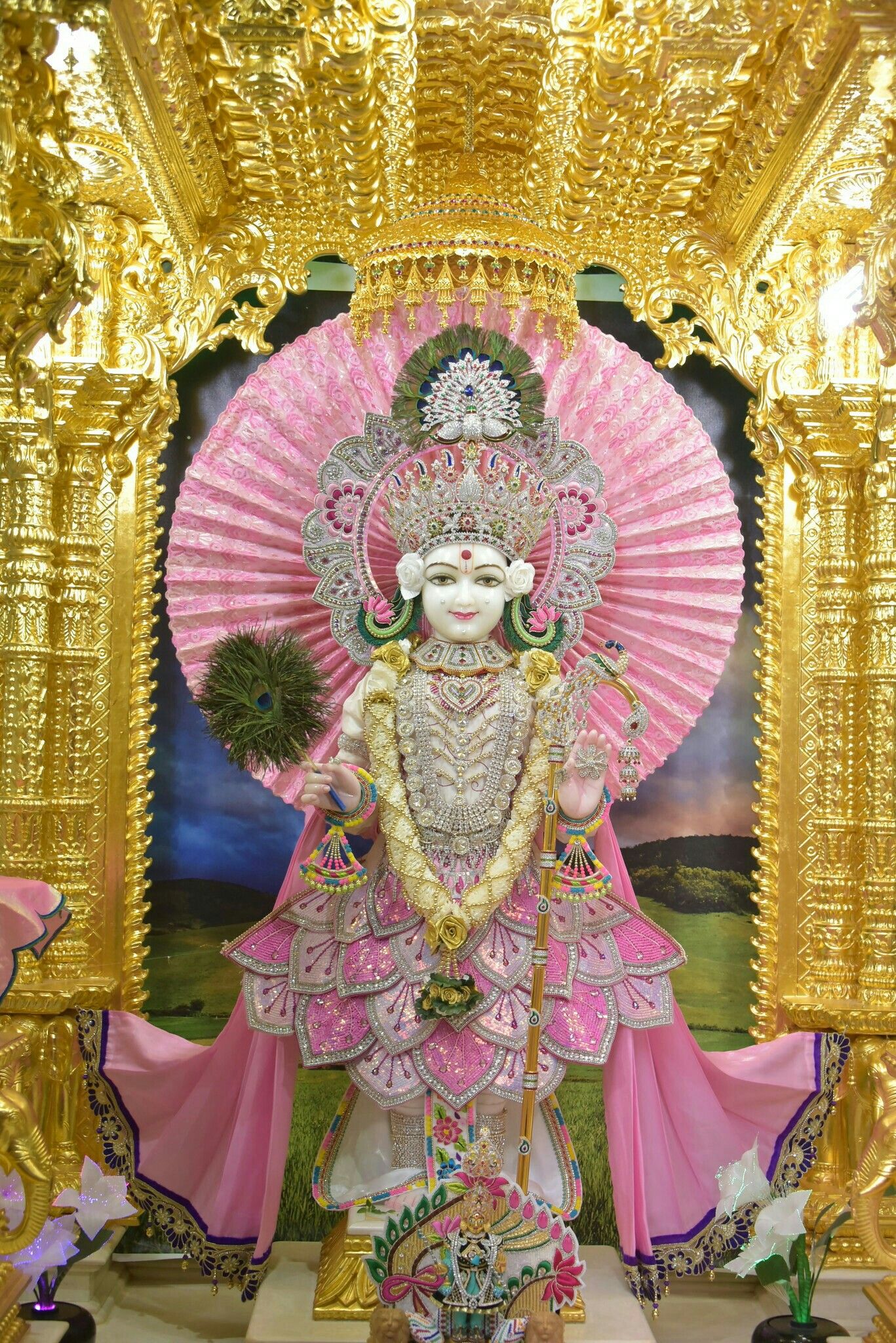 Swaminarayan idol in ornate golden temple
