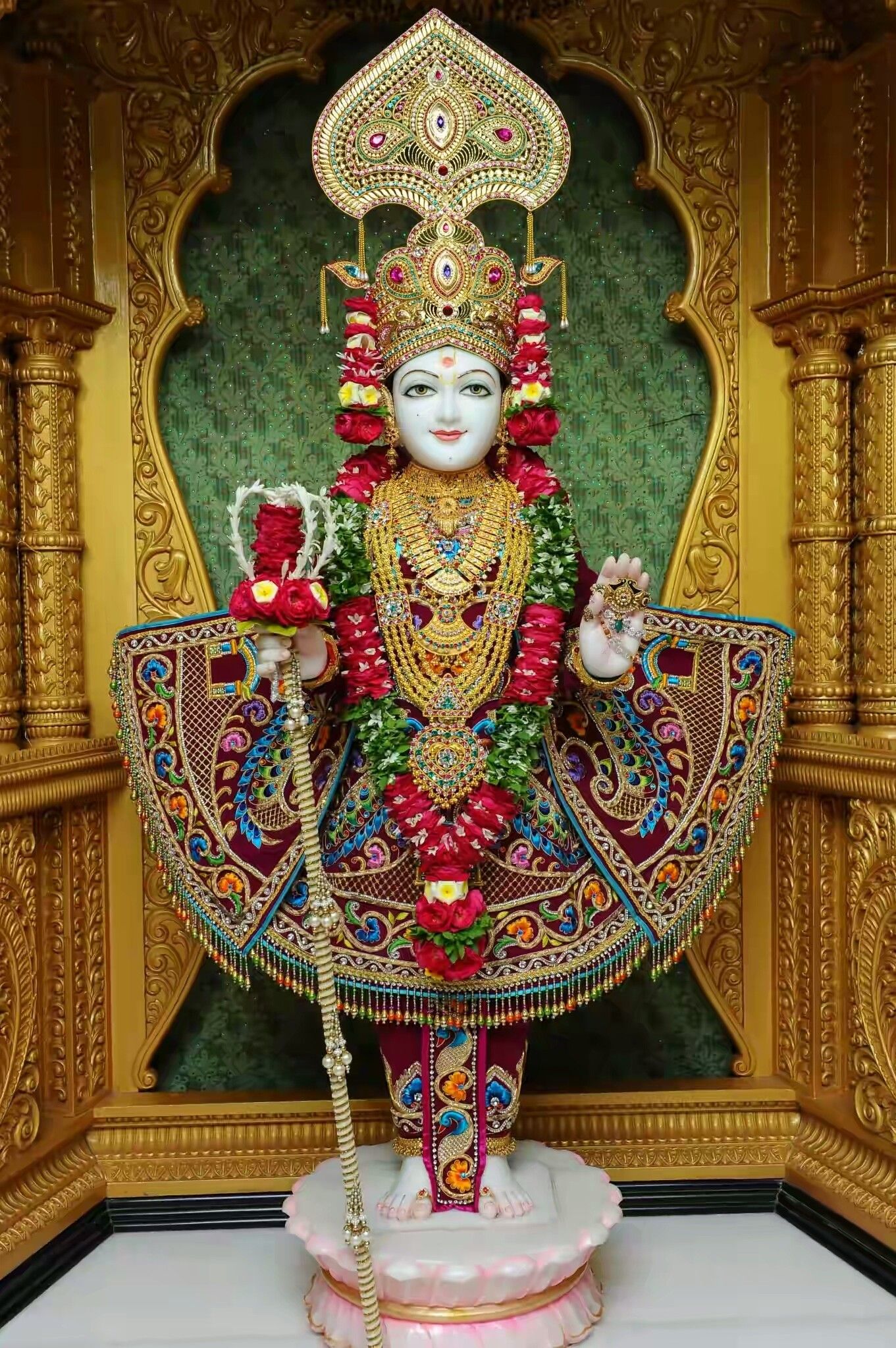 Swaminarayan deity in ornate golden temple