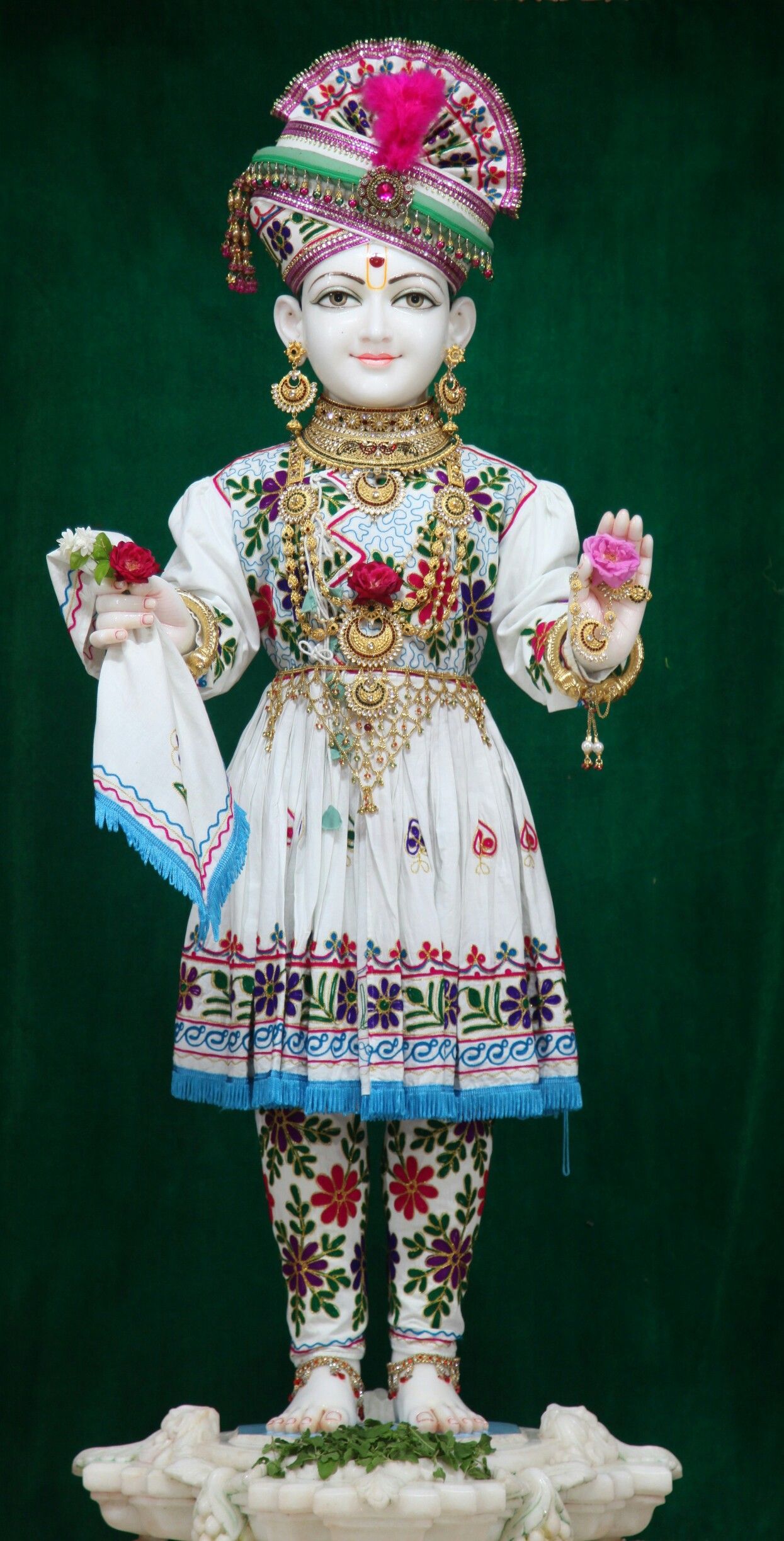 Swaminarayan deity in ornate clothing