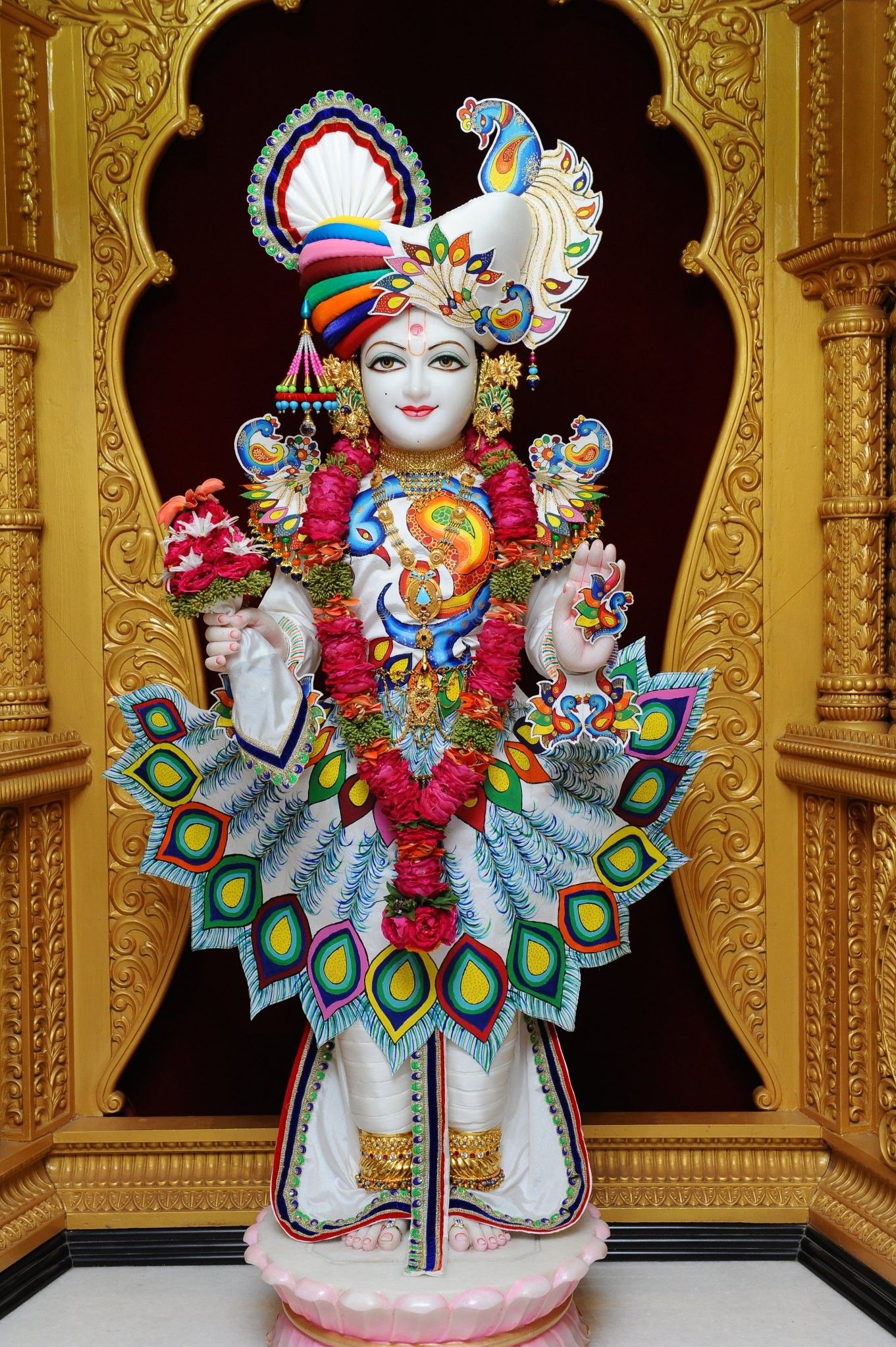 Swaminarayan murti adorned with flowers