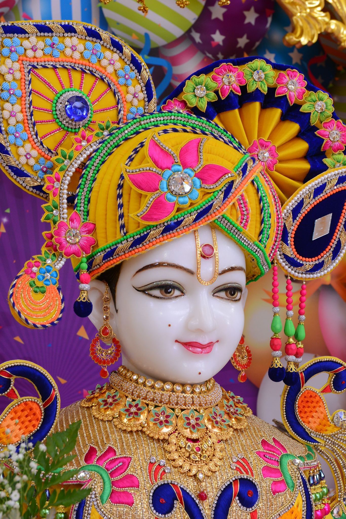 Beautiful Swaminarayan deity with floral crown
