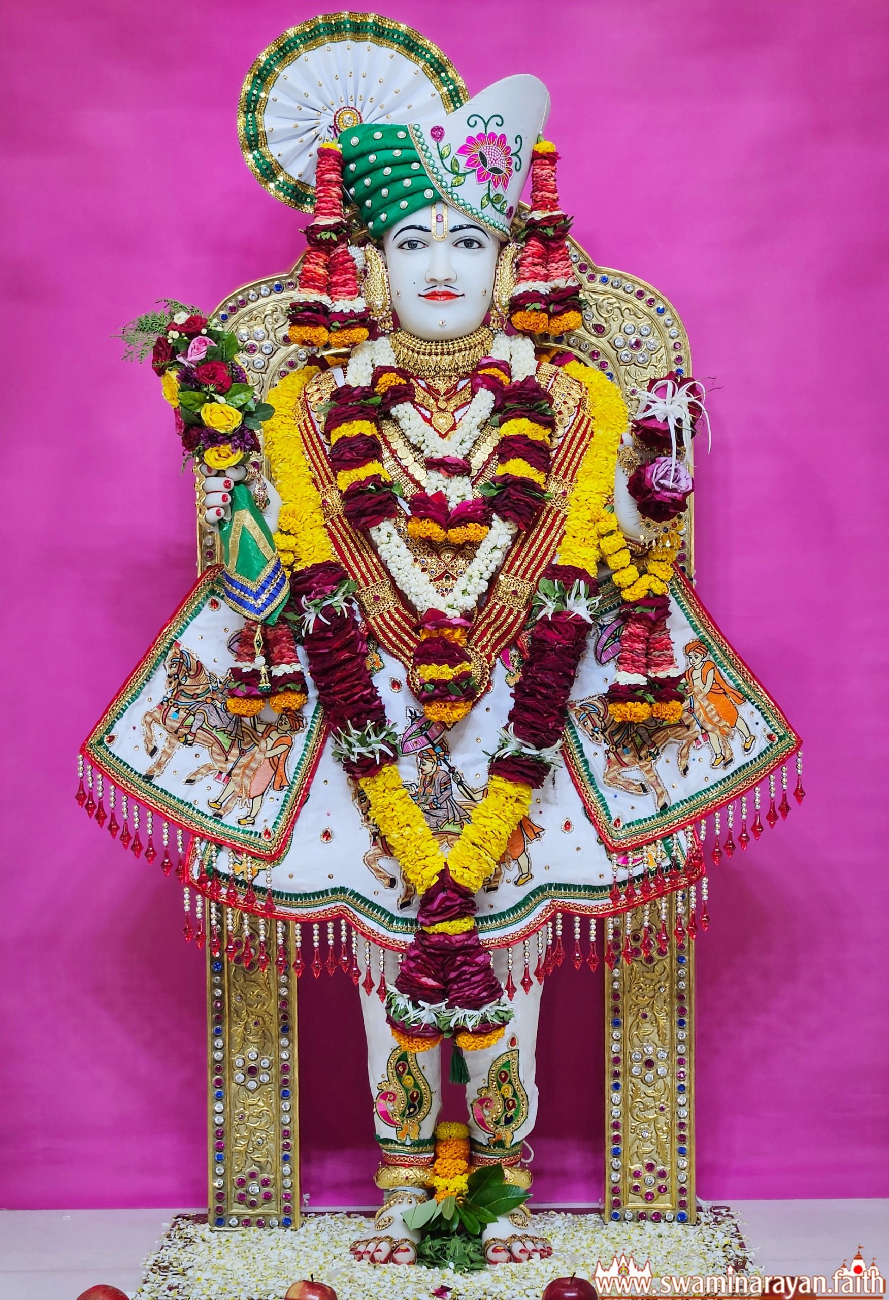 Swaminarayan adorned with floral garlands.