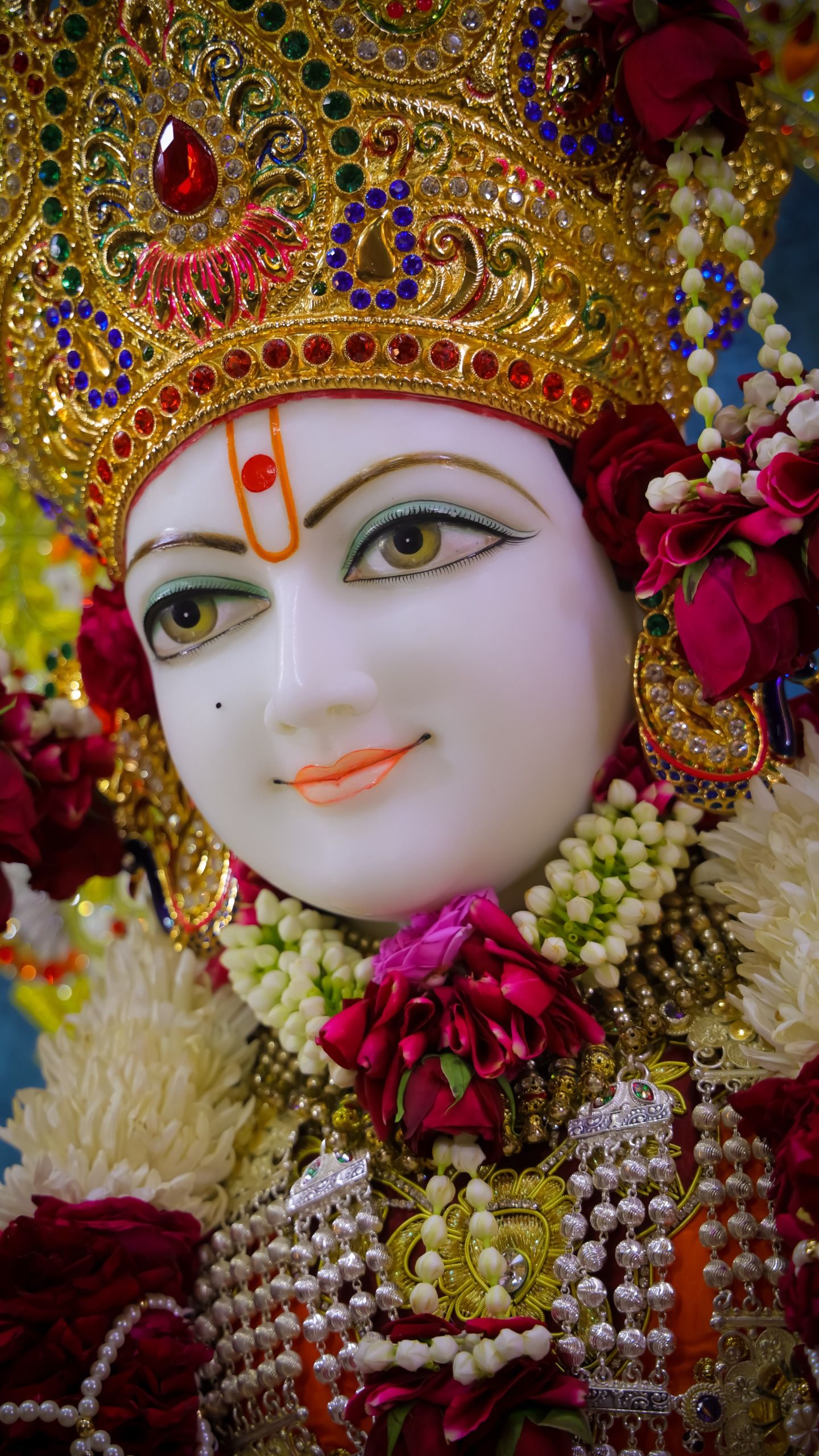Close-up of Swaminarayan\'s serene face.