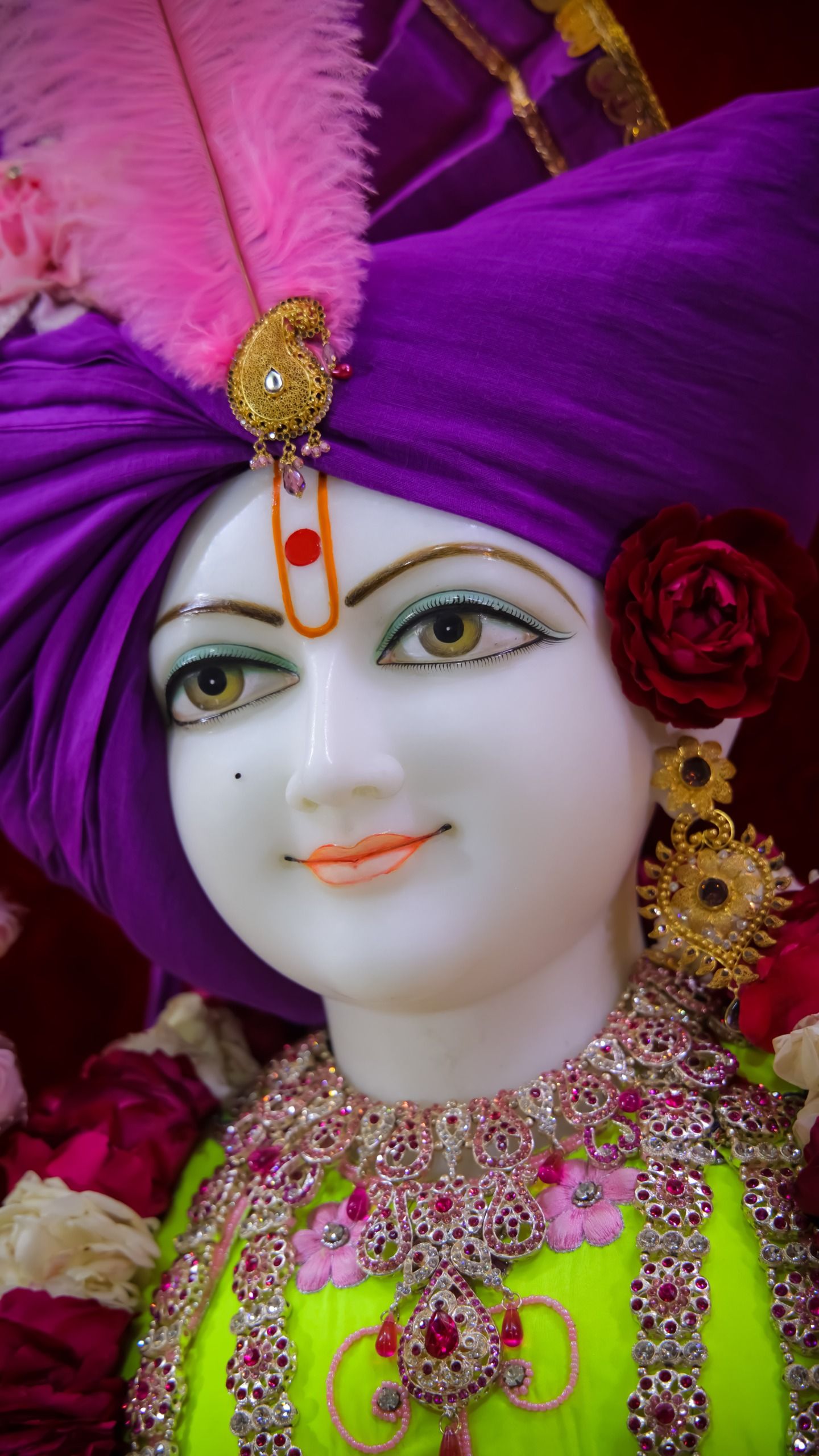 Close-up of Swaminarayan with flowers