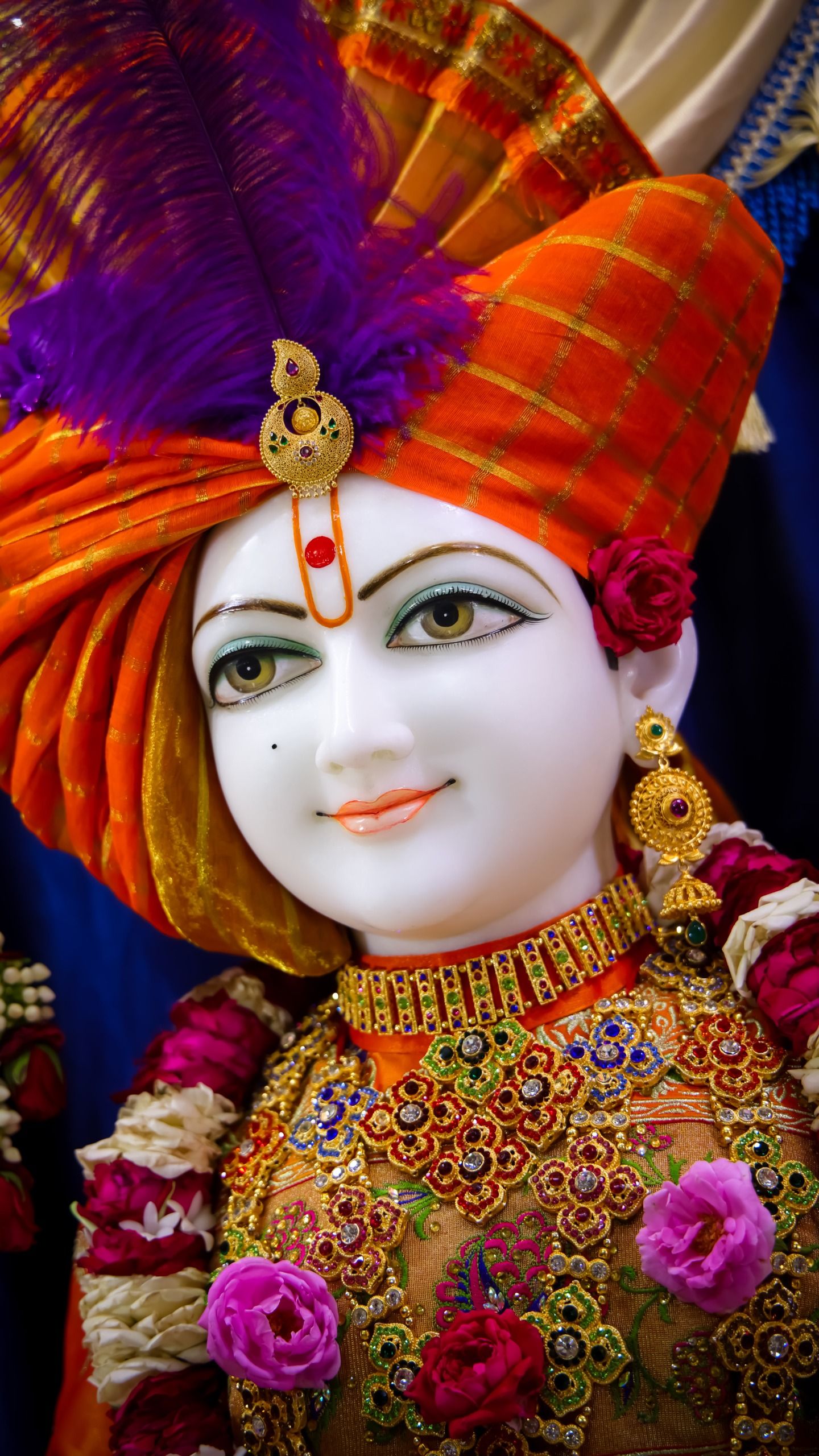 Swaminarayan with ornate floral garland