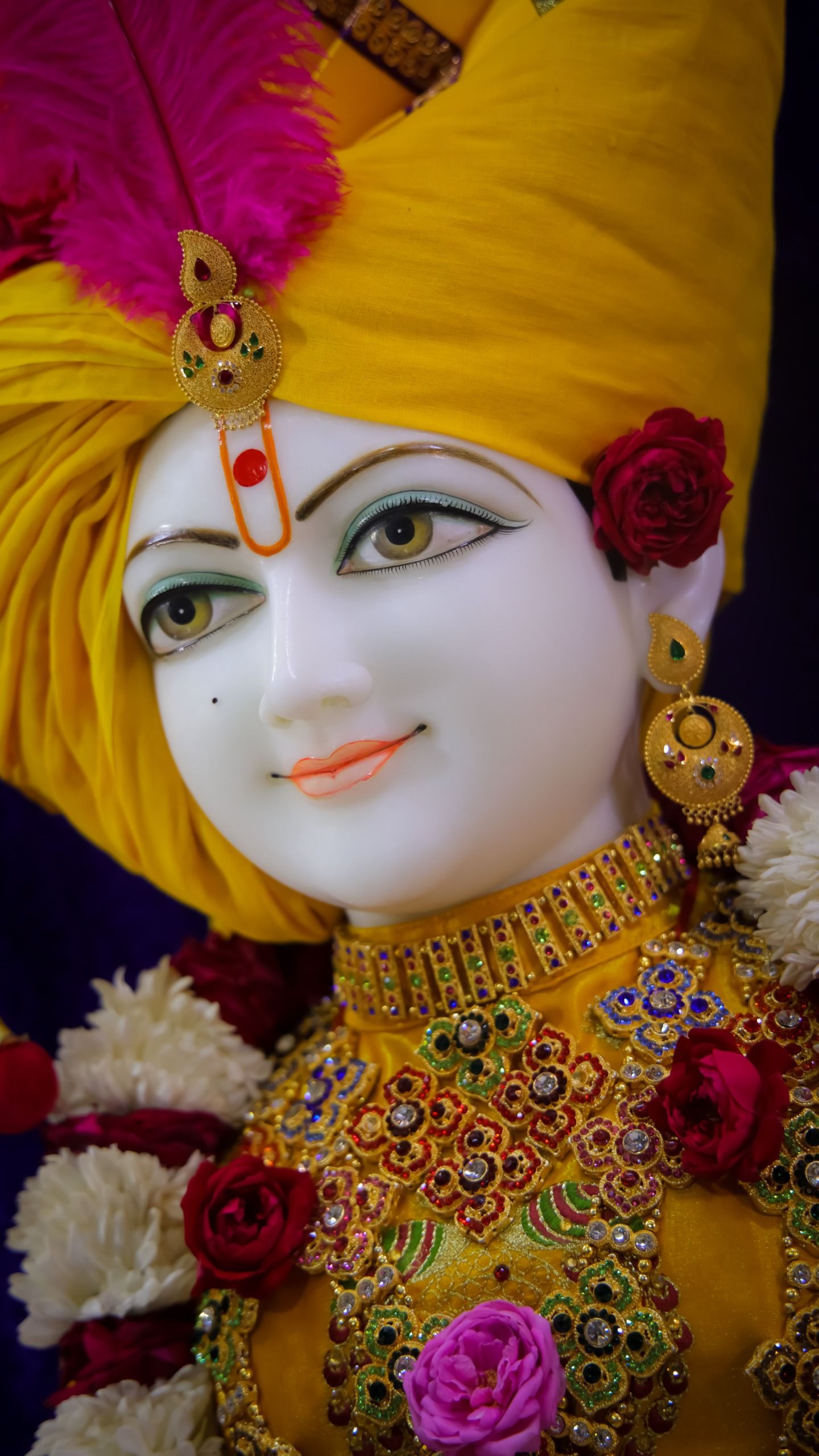 Swaminarayan with floral decorations and turban