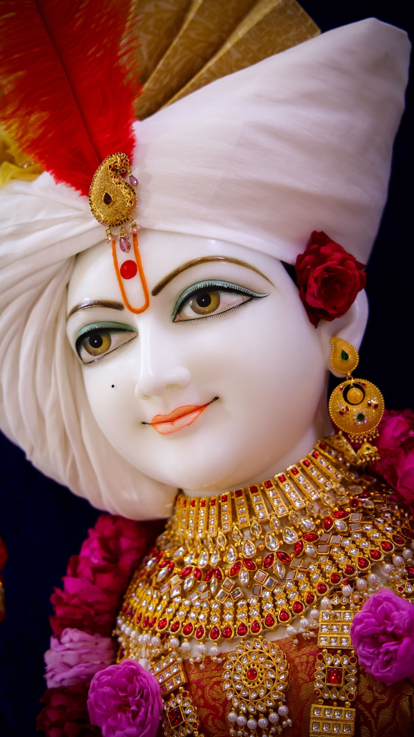 Close-up of Swaminarayan with floral adornments