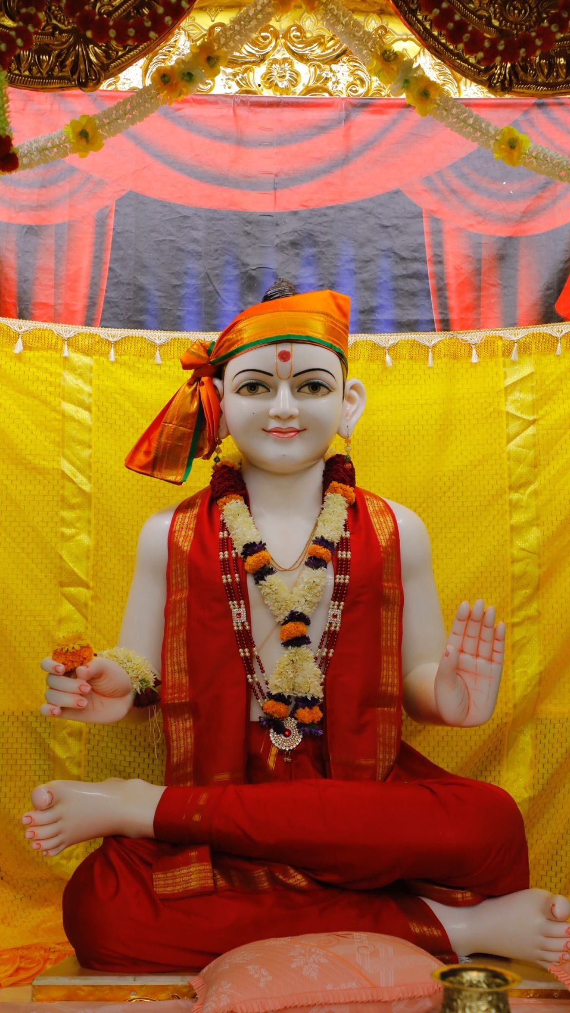 Swaminarayan statue in peaceful temple setting
