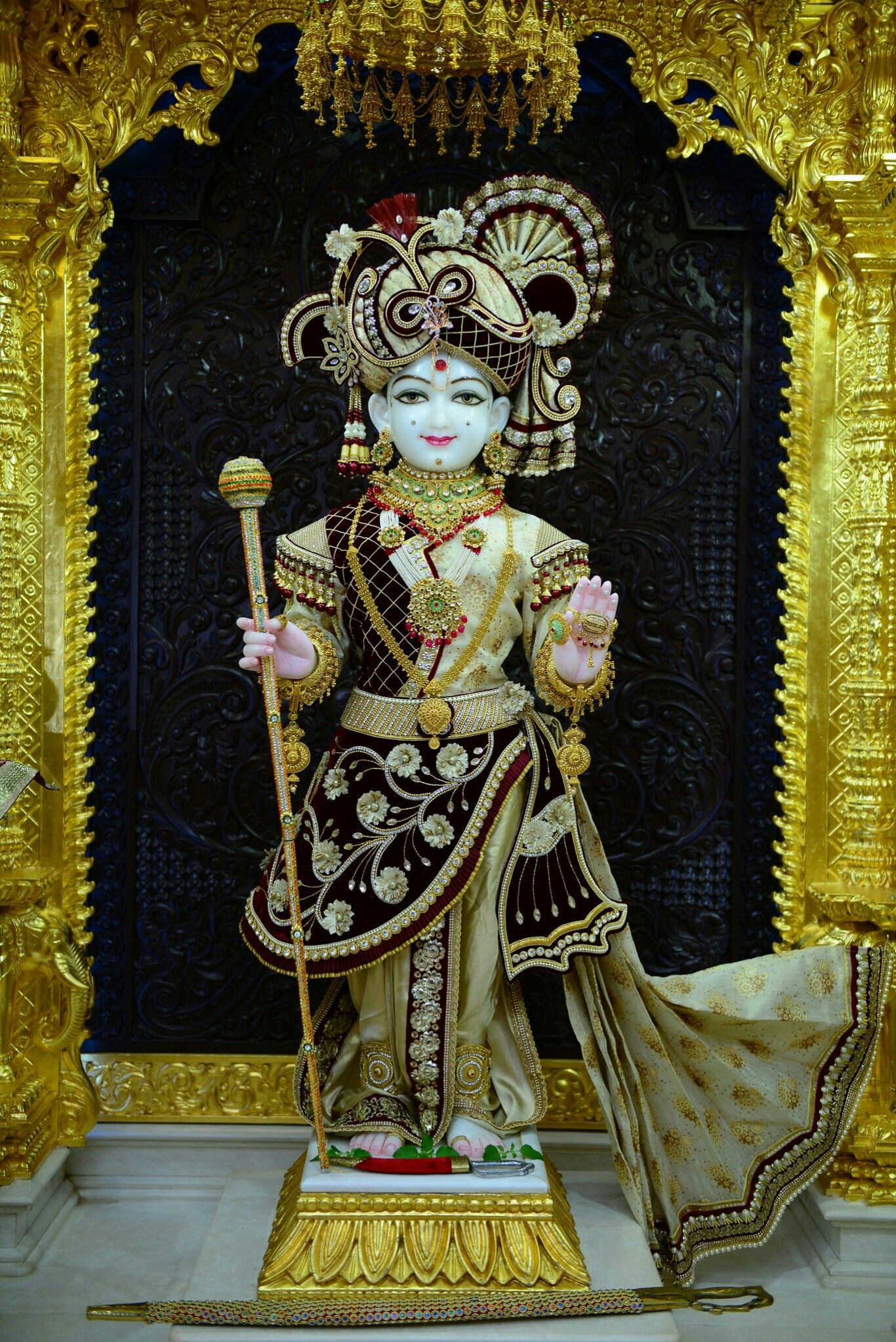 Golden statue of Swaminarayan deity