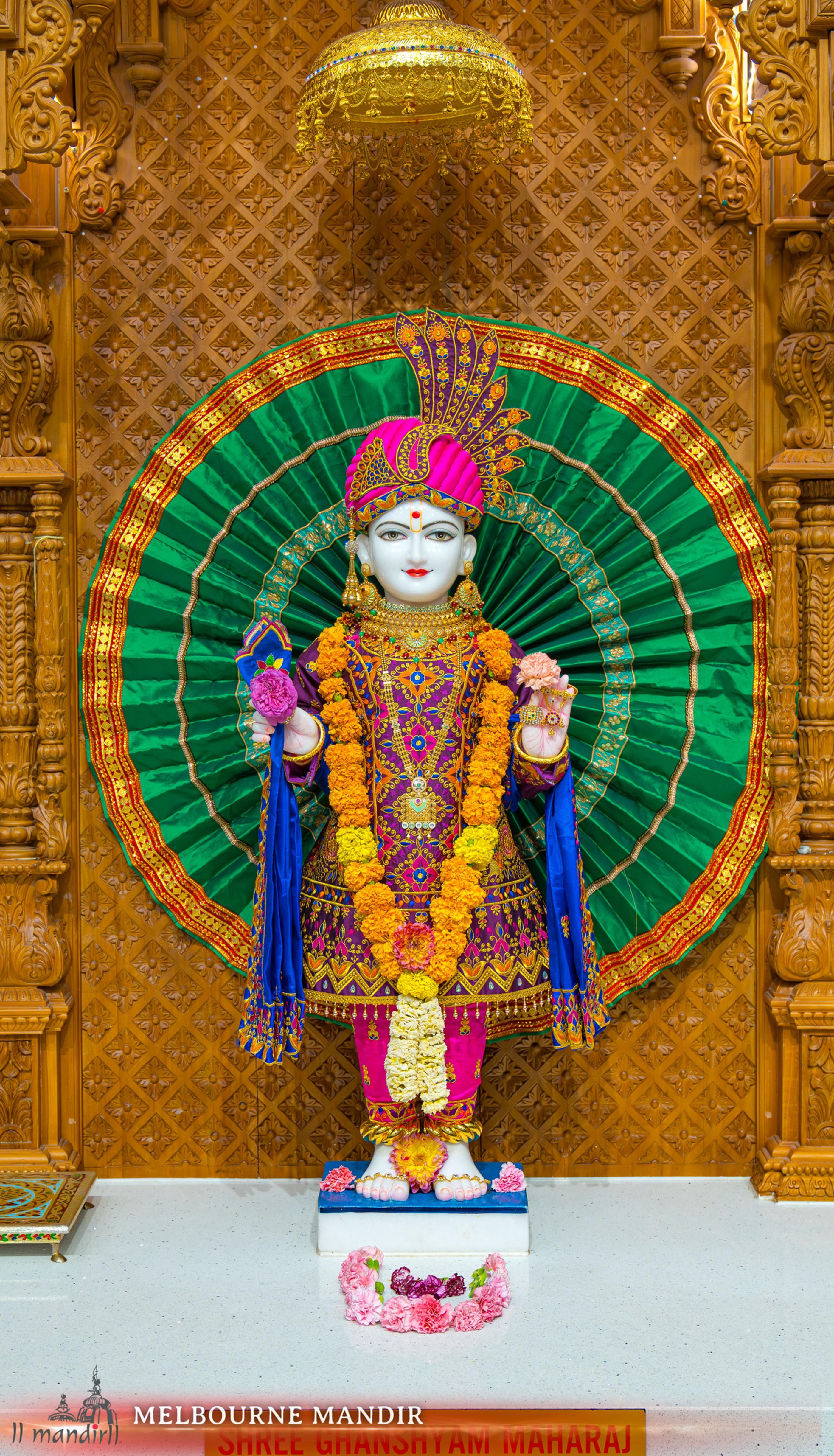 Swaminarayan statue in ornate mandir