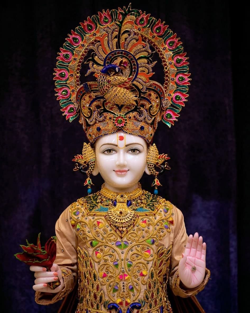 Swaminarayan with ornate peacock crown