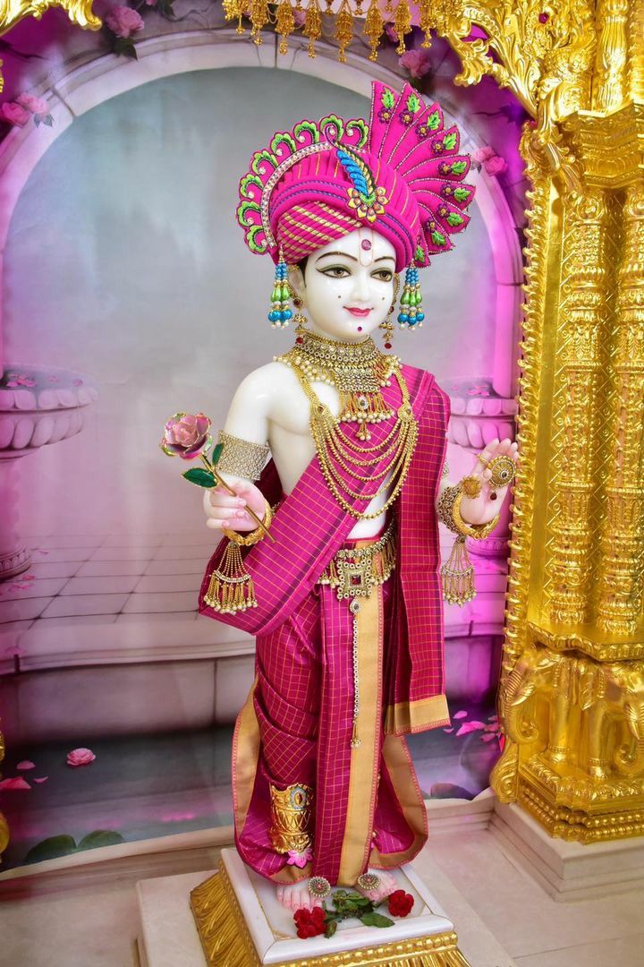 Swaminarayan statue with rose in temple