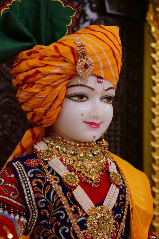 Swaminarayan with orange turban and jewels