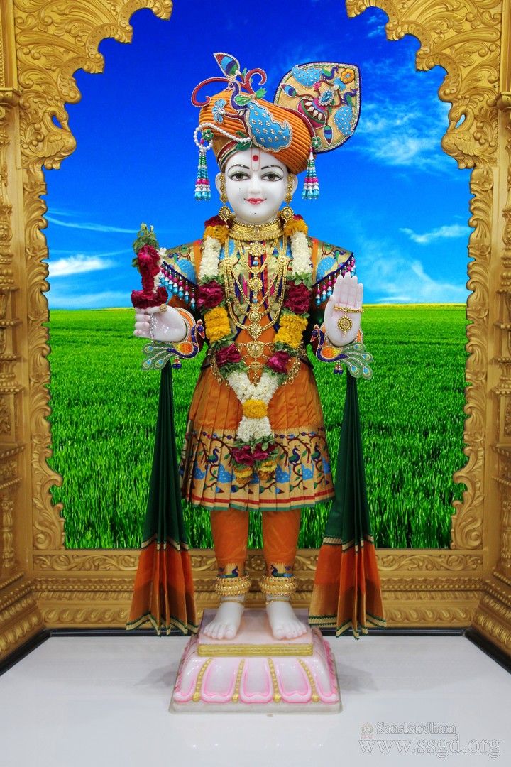 Swaminarayan statue in a temple setting