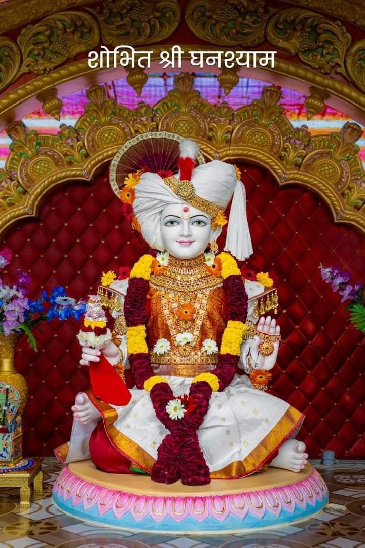 Swaminarayan deity adorned in gold jewelry