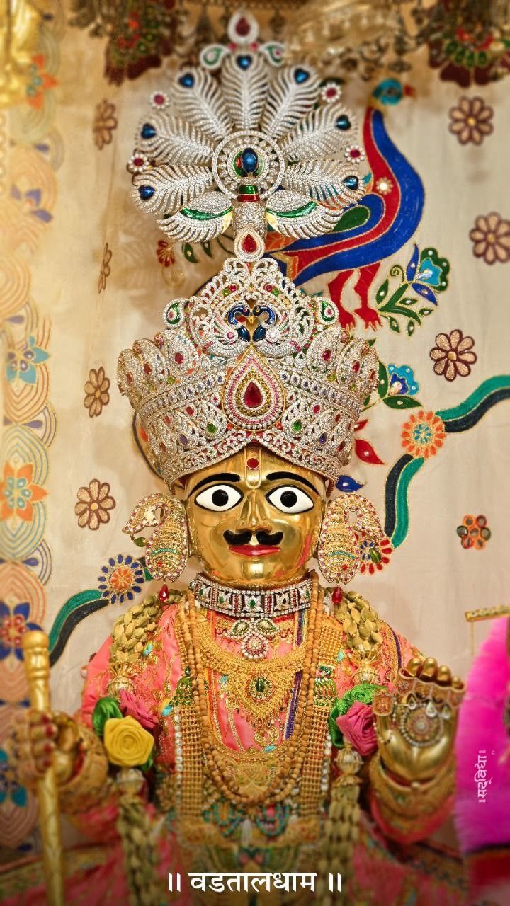 Swaminarayan with ornate golden crown