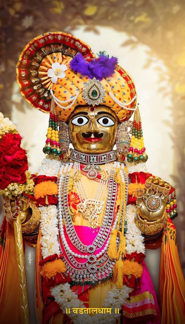 Swaminarayan deity adorned in gold jewels