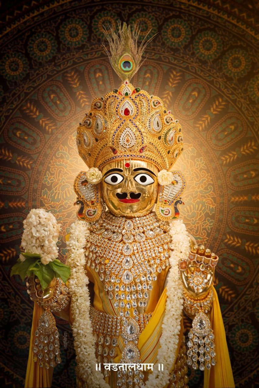 Swaminarayan with crown and floral garlands